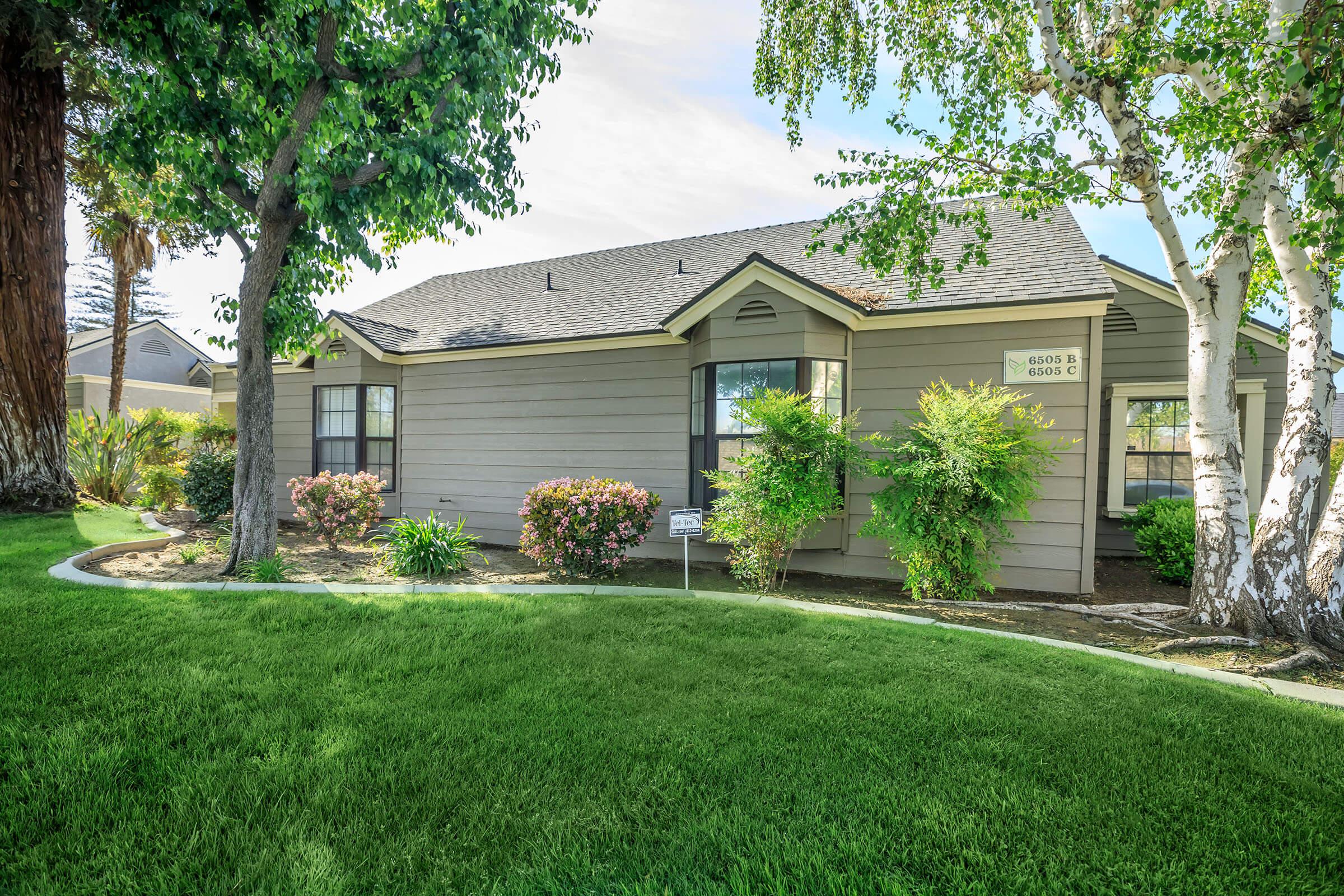 a large lawn in front of a house