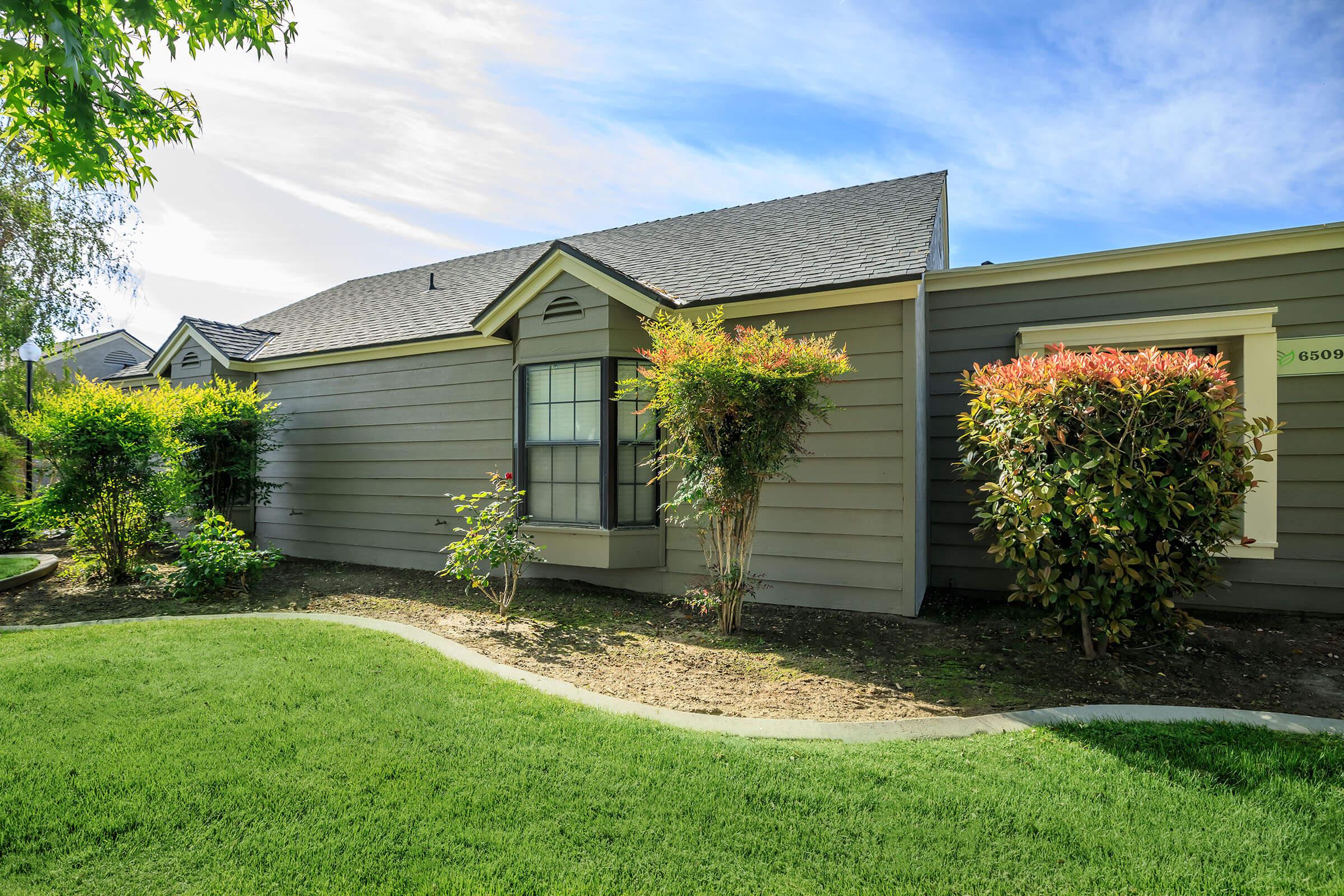 a large lawn in front of a house