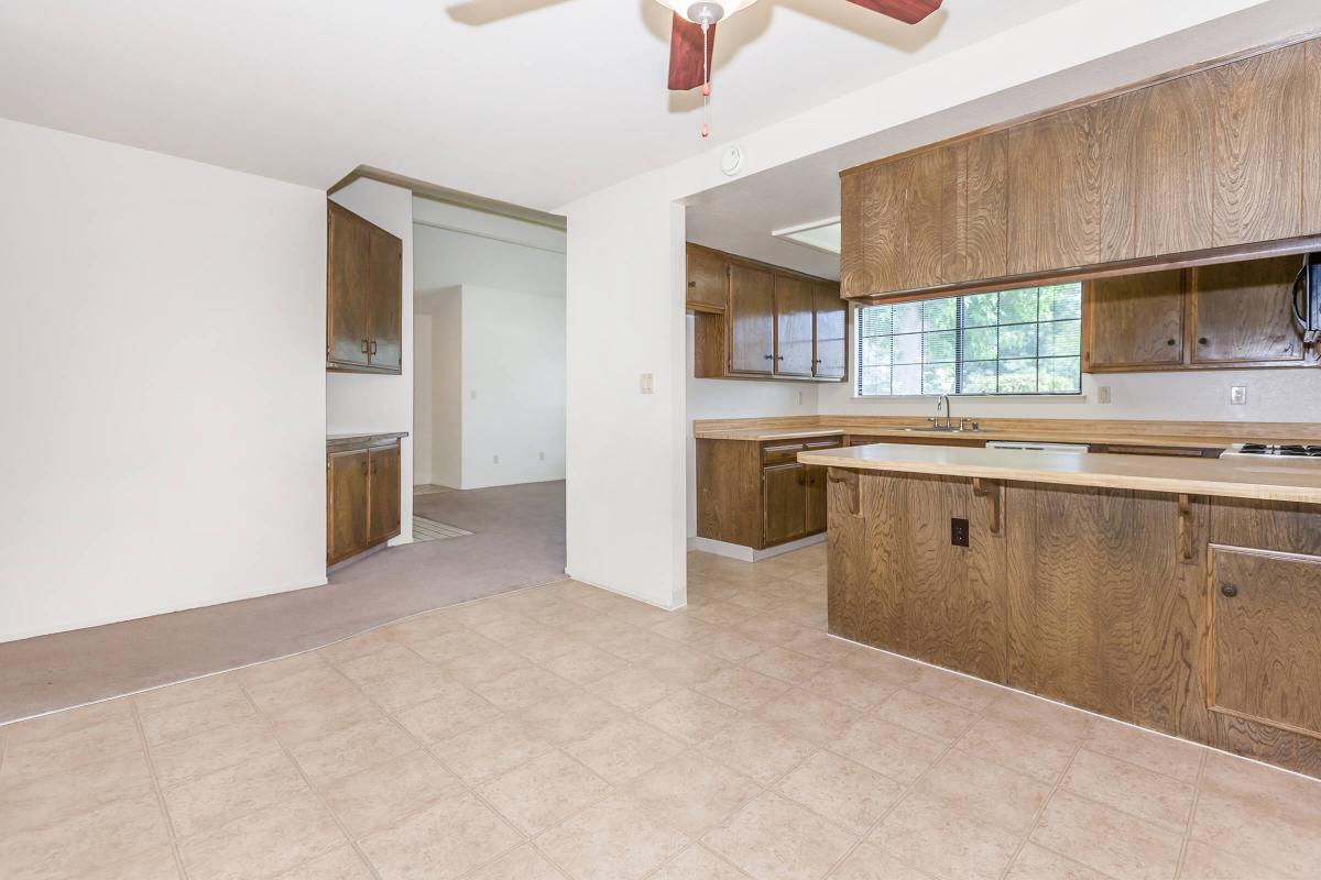 a kitchen with a tile floor