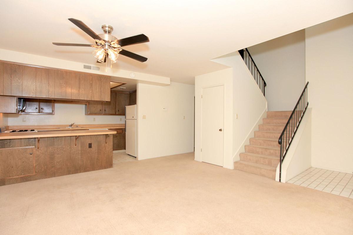 a kitchen with wooden cabinets