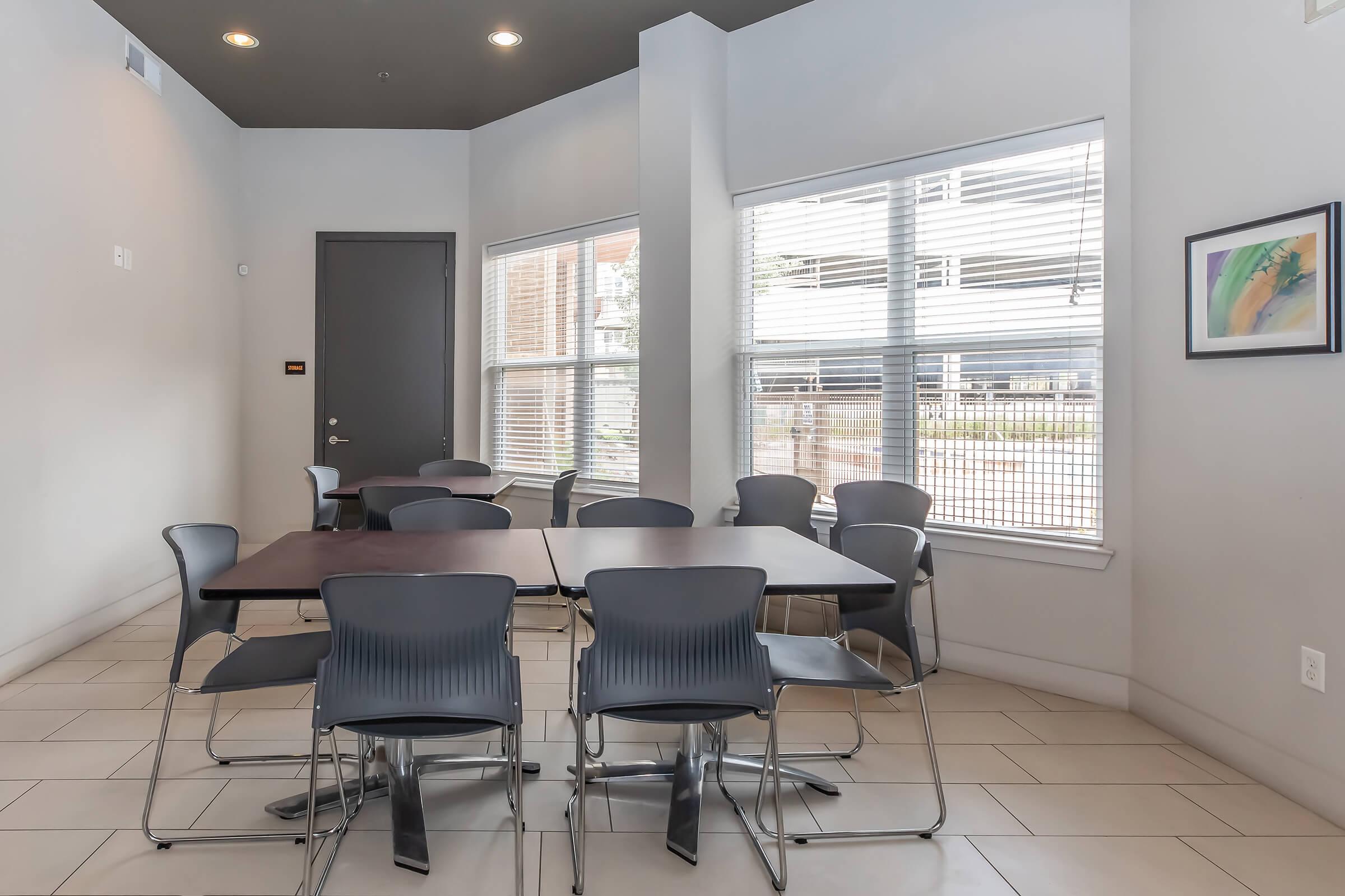 a room filled with furniture and a large window