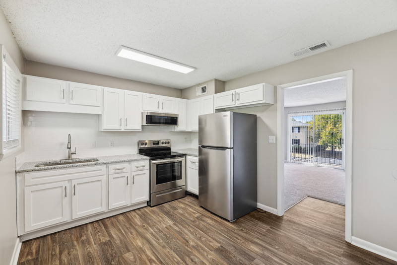 a kitchen with a wood floor