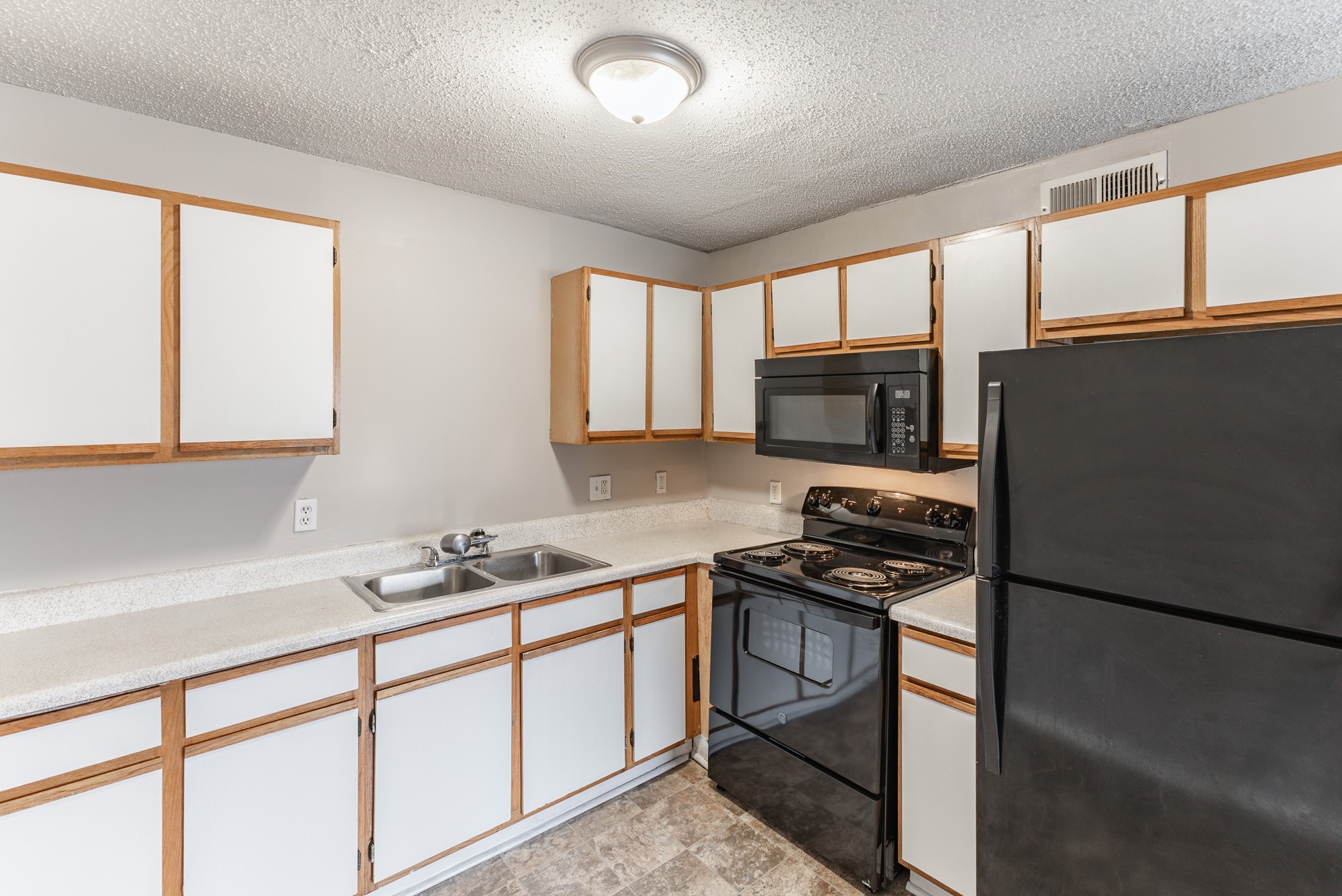 a kitchen with a stove and a sink