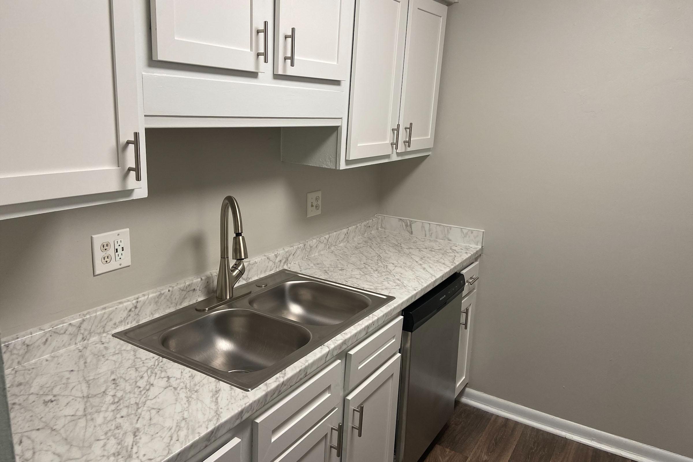 a kitchen with a stove and a sink