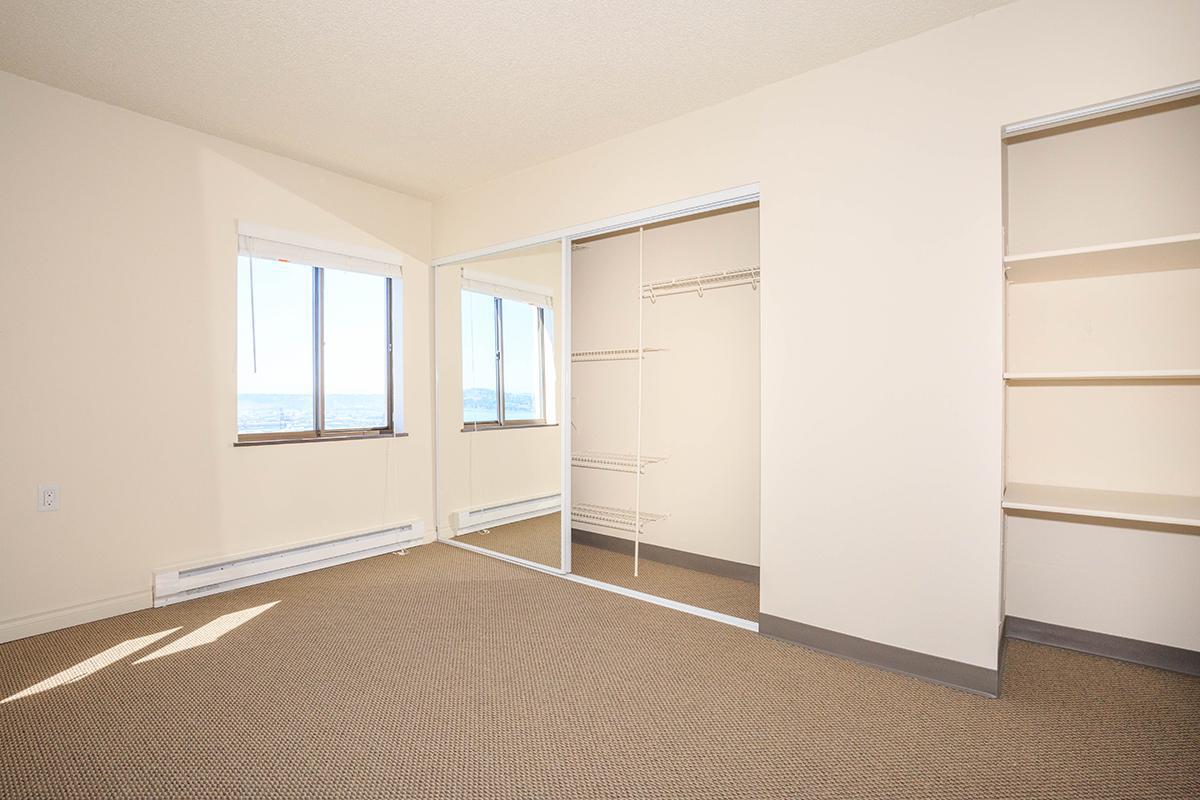 a bedroom with a bed in a room