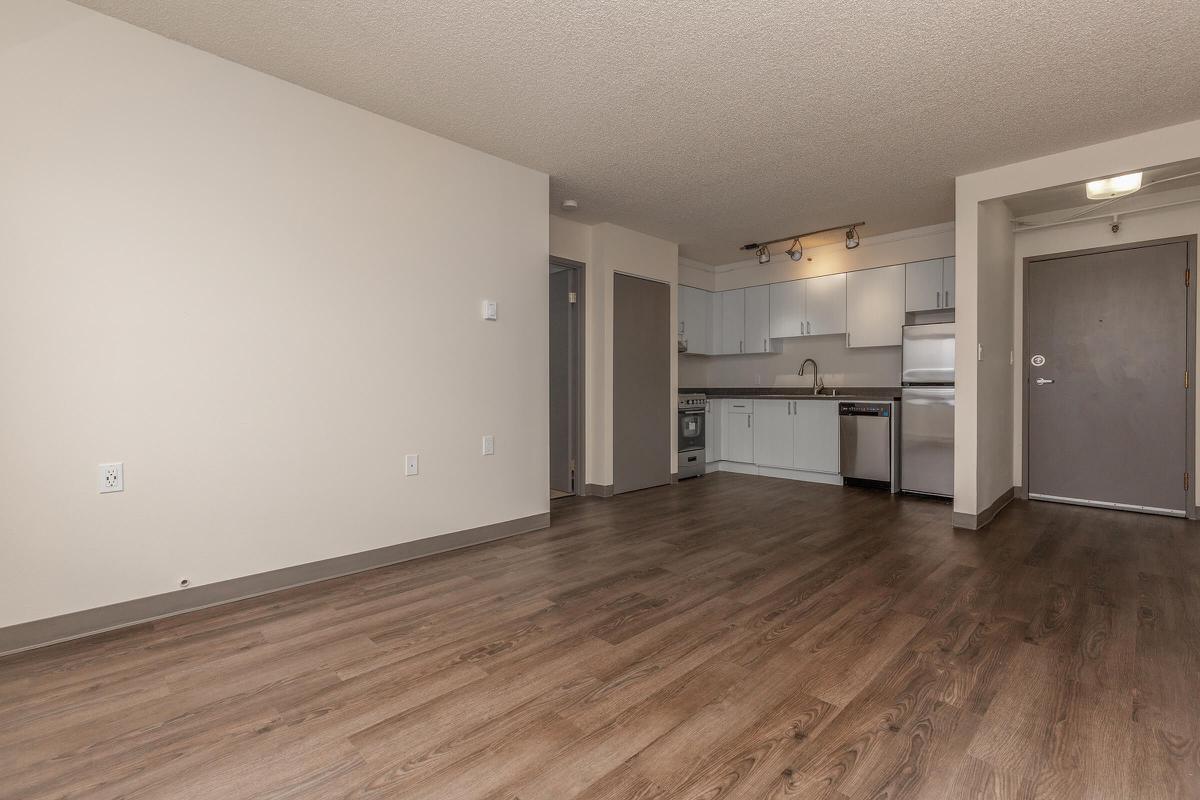 a large empty room with a wood floor
