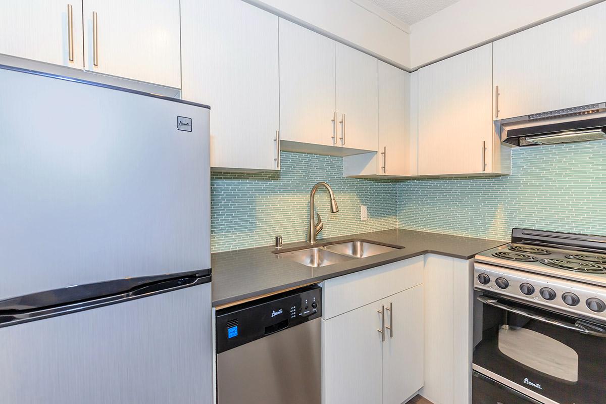 a kitchen with a stove top oven