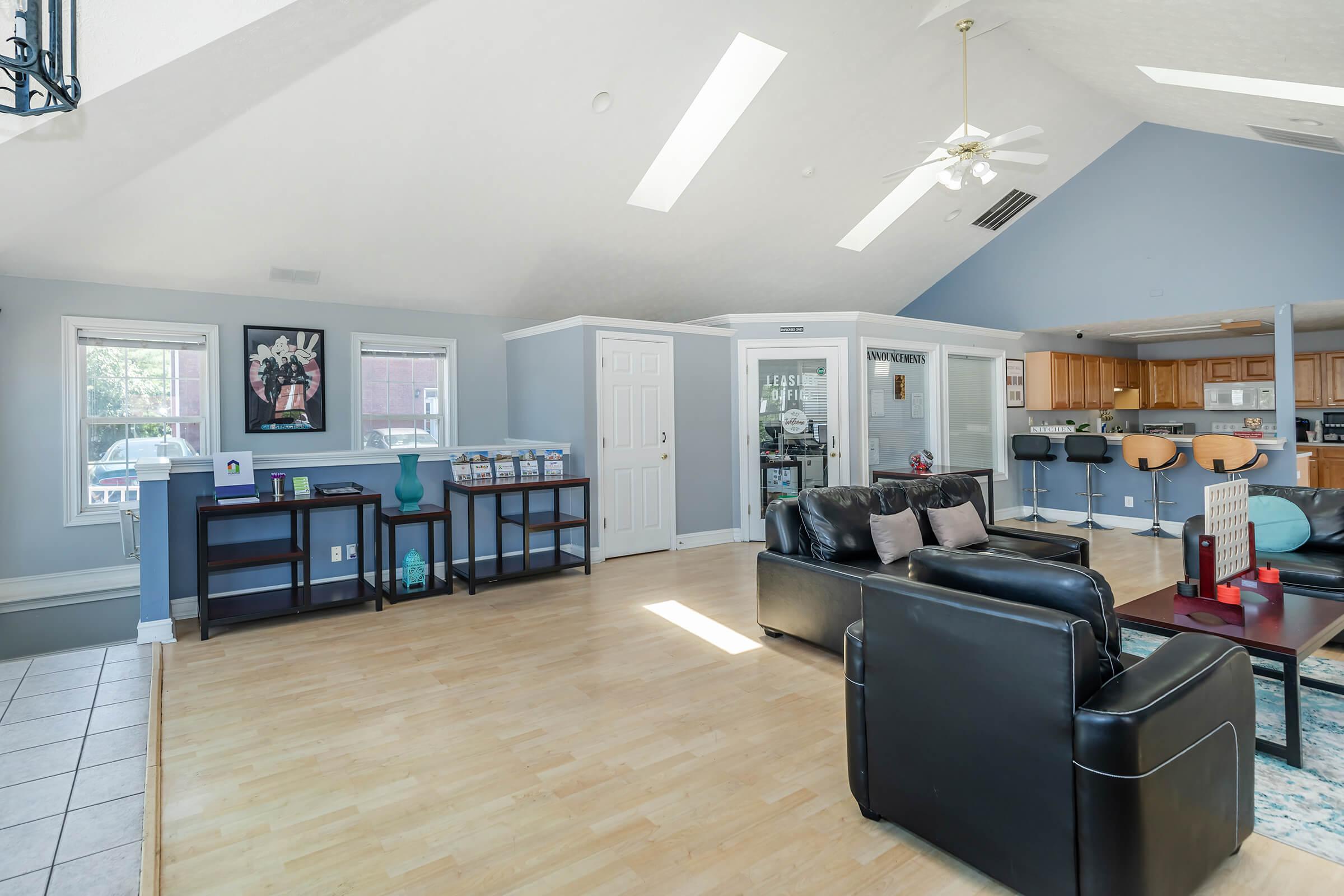 a room filled with furniture and a wood floor