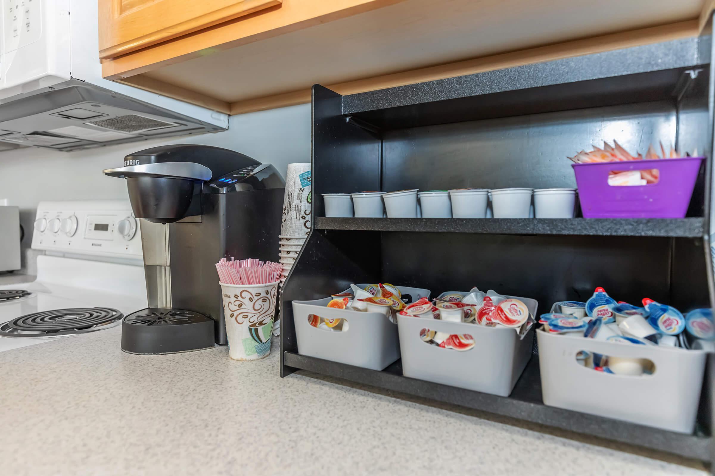 a kitchen with a sink and a microwave