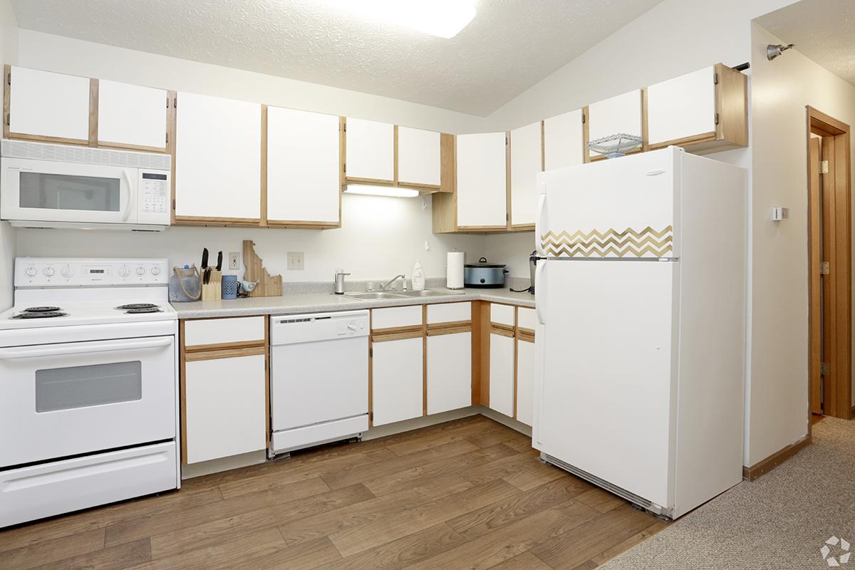 a kitchen with a wood floor