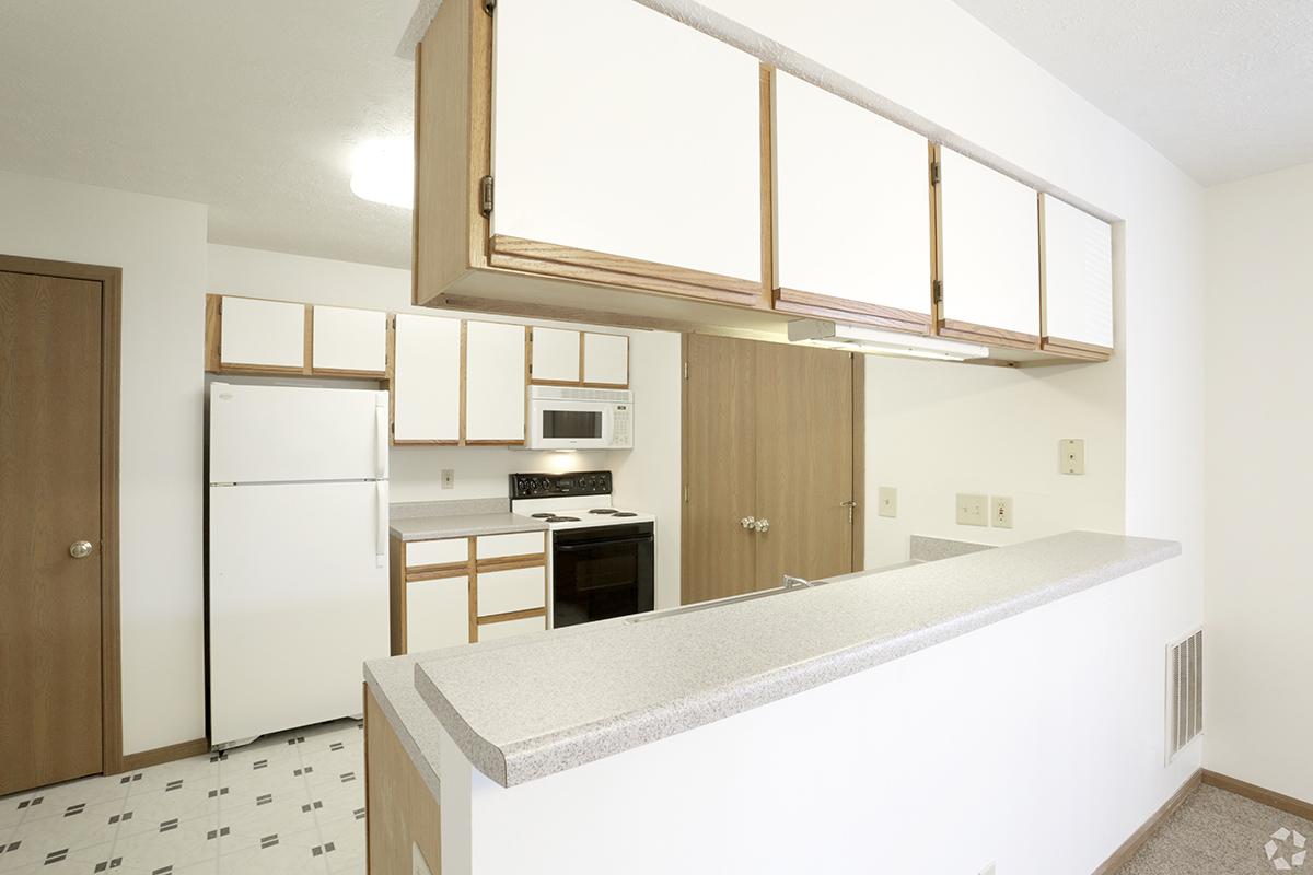 a kitchen with a sink and a refrigerator