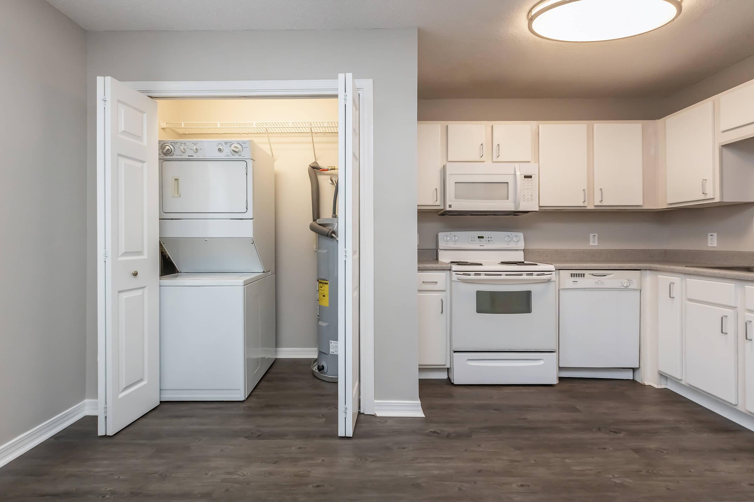 a kitchen with a stove and a refrigerator