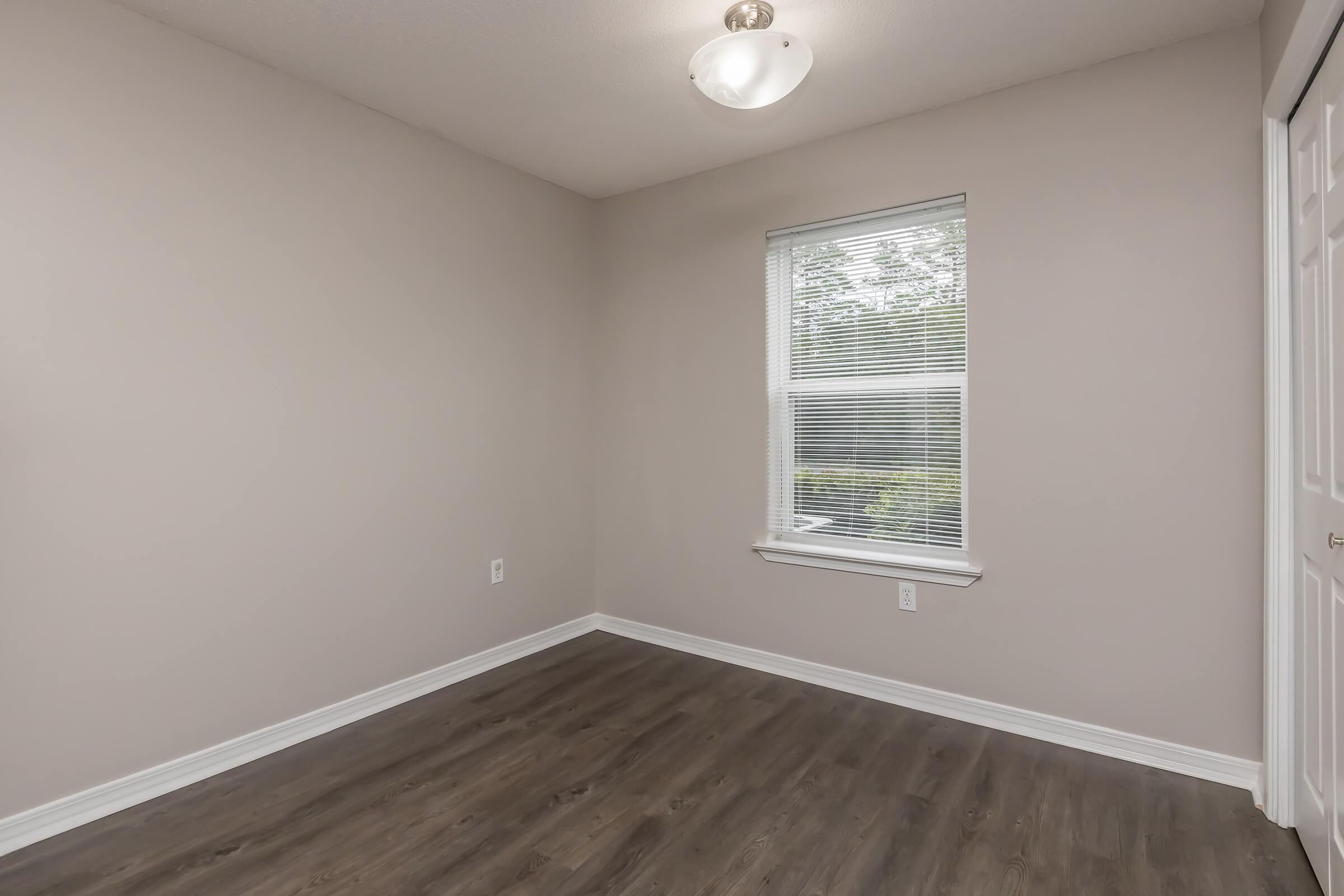 a room with a sink and a window