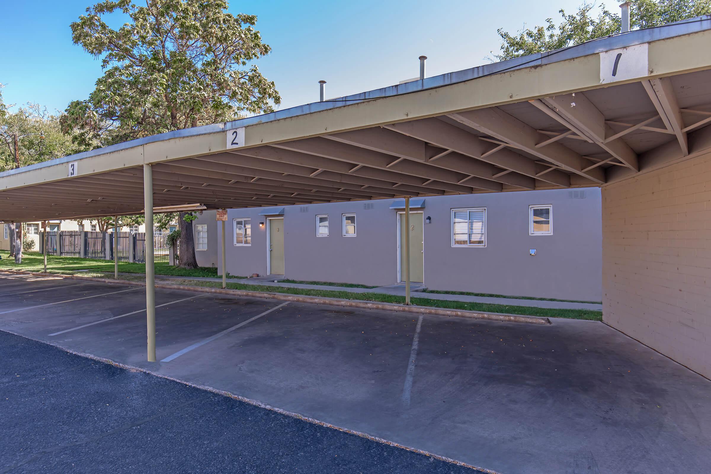 an empty parking lot in front of a building