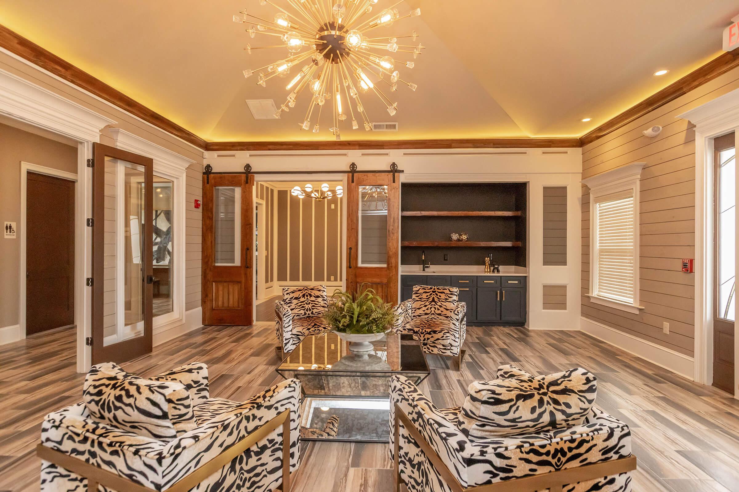 a living room filled with furniture and a fireplace