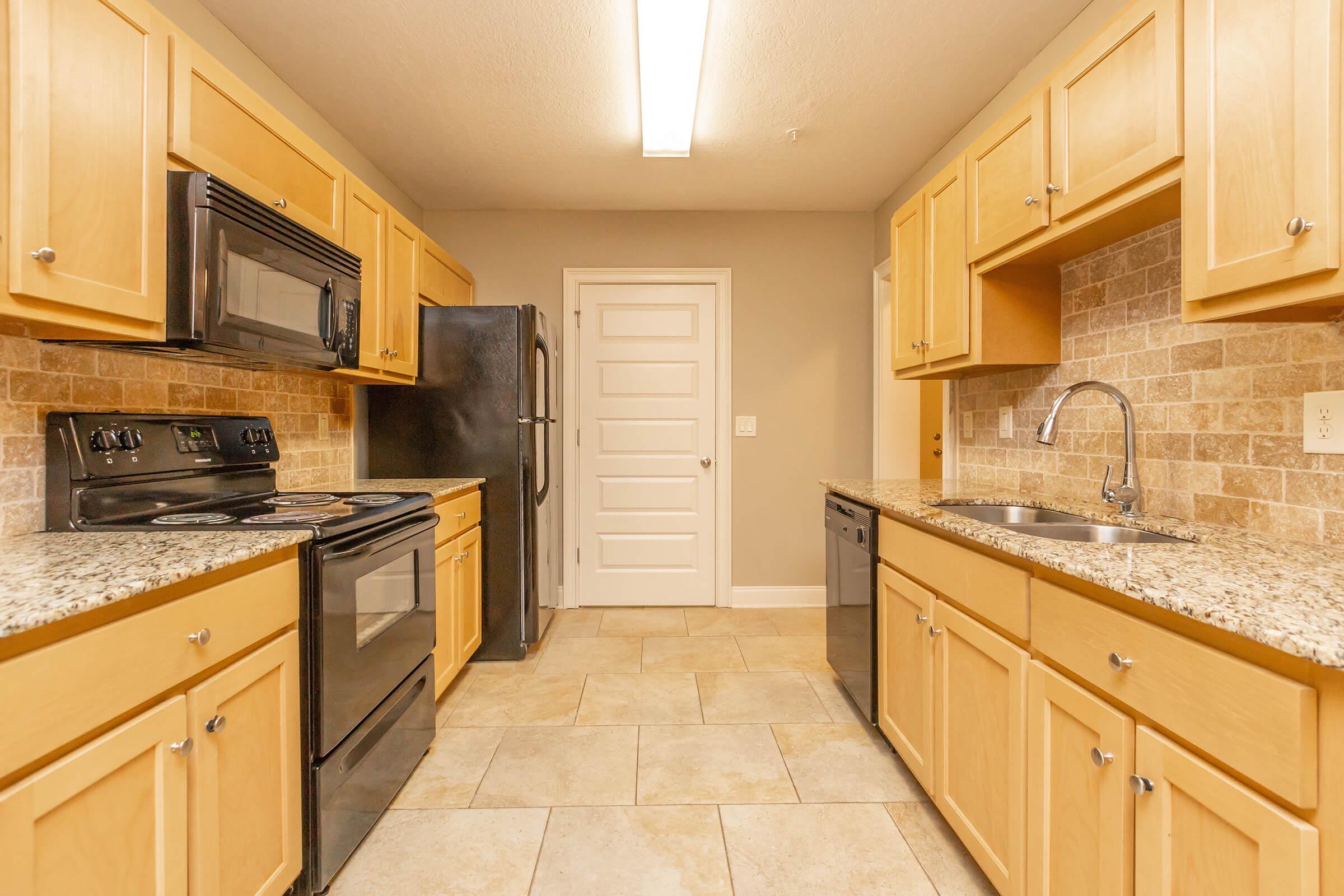 a kitchen with a sink and a microwave