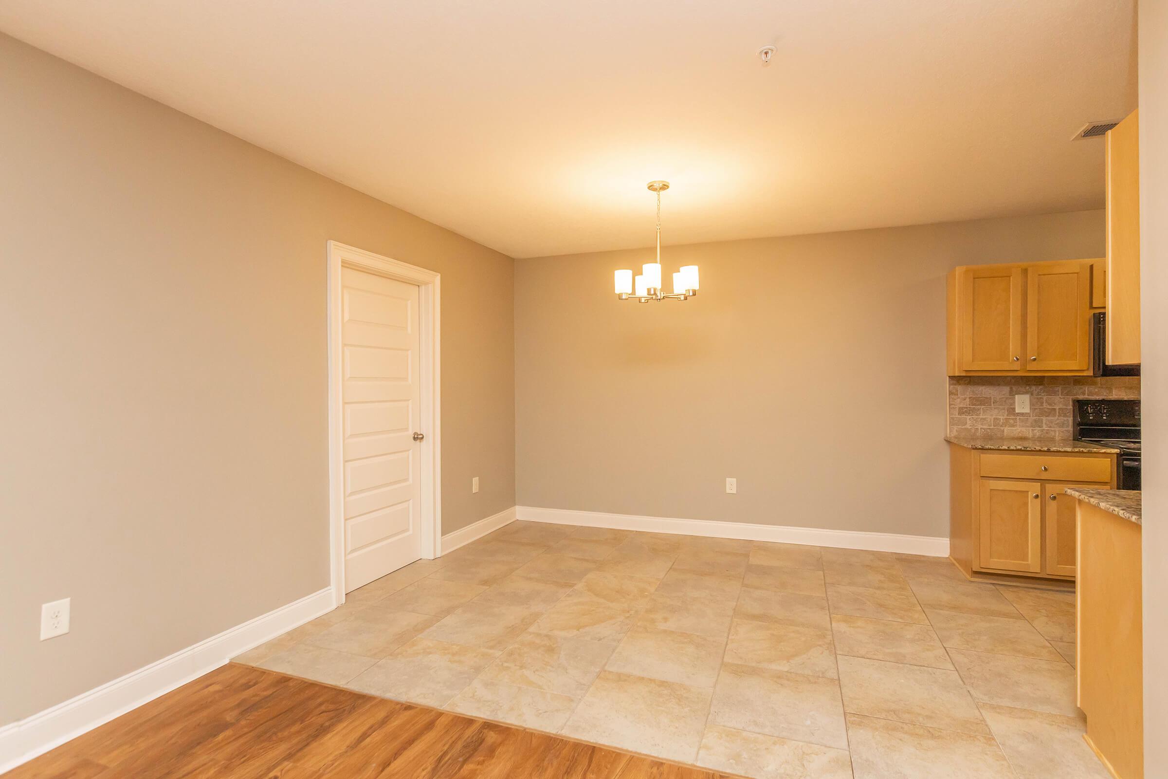 a kitchen with a wood floor