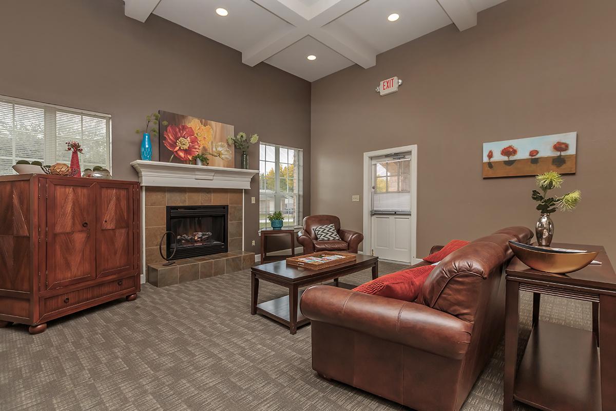 a living room filled with furniture and a tv