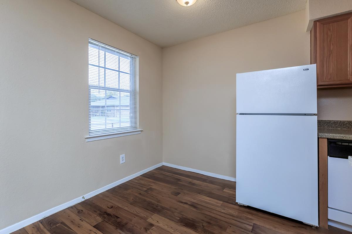 a kitchen with a wood floor