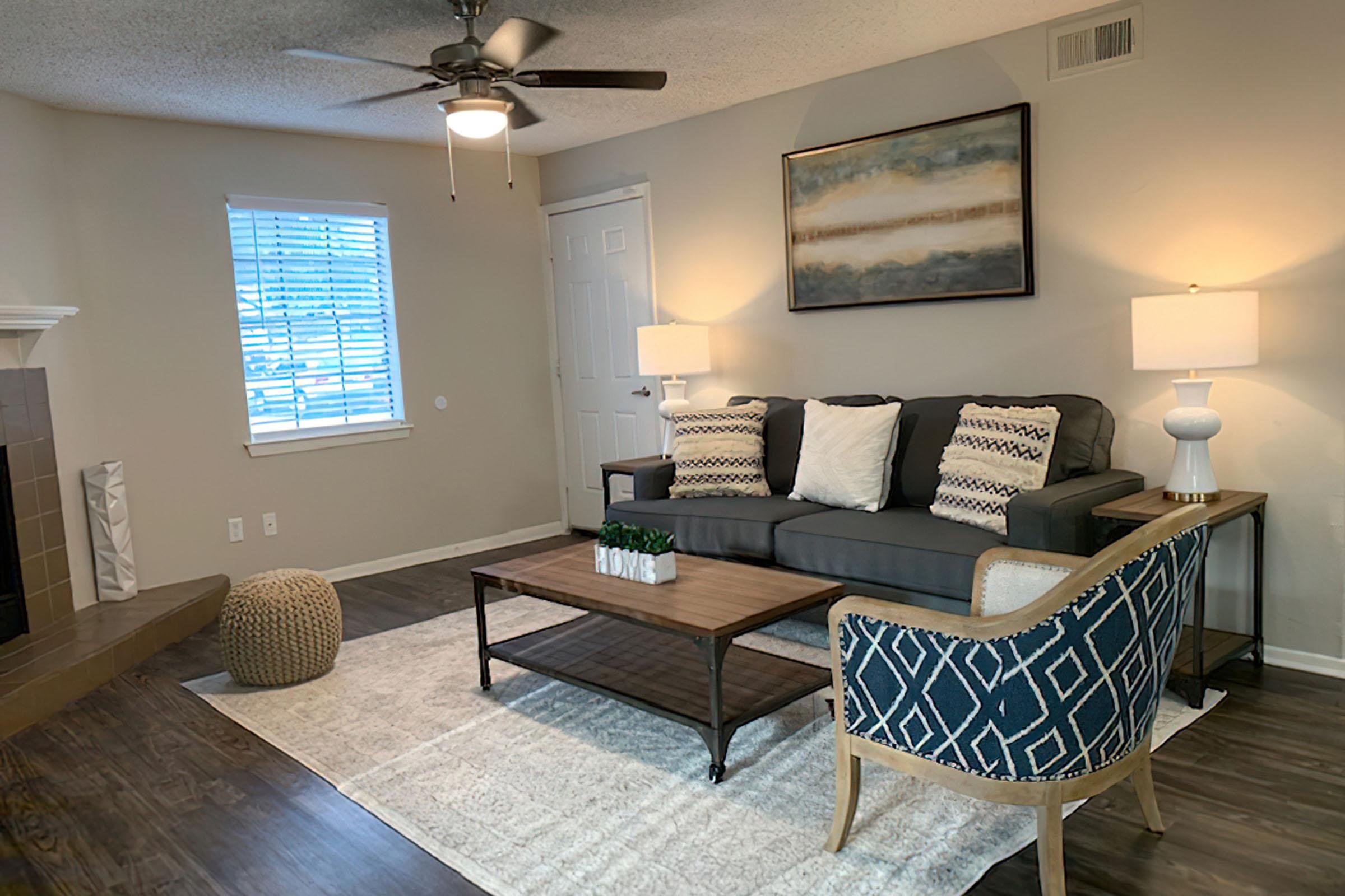 a living room filled with furniture and a tv