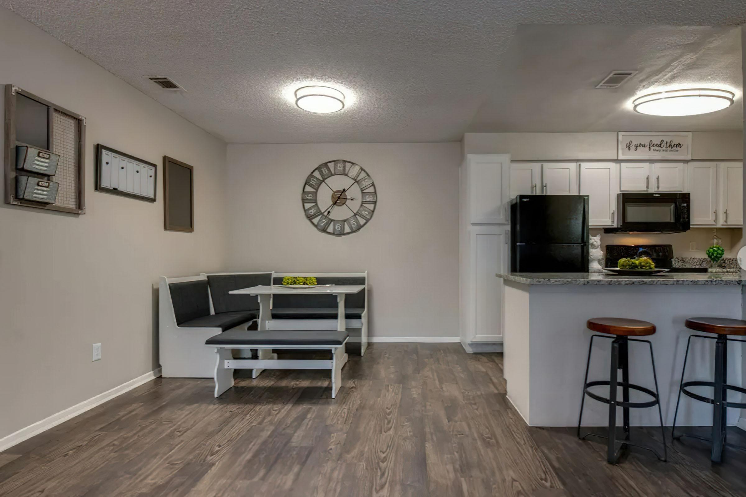 a living room filled with furniture and a stove