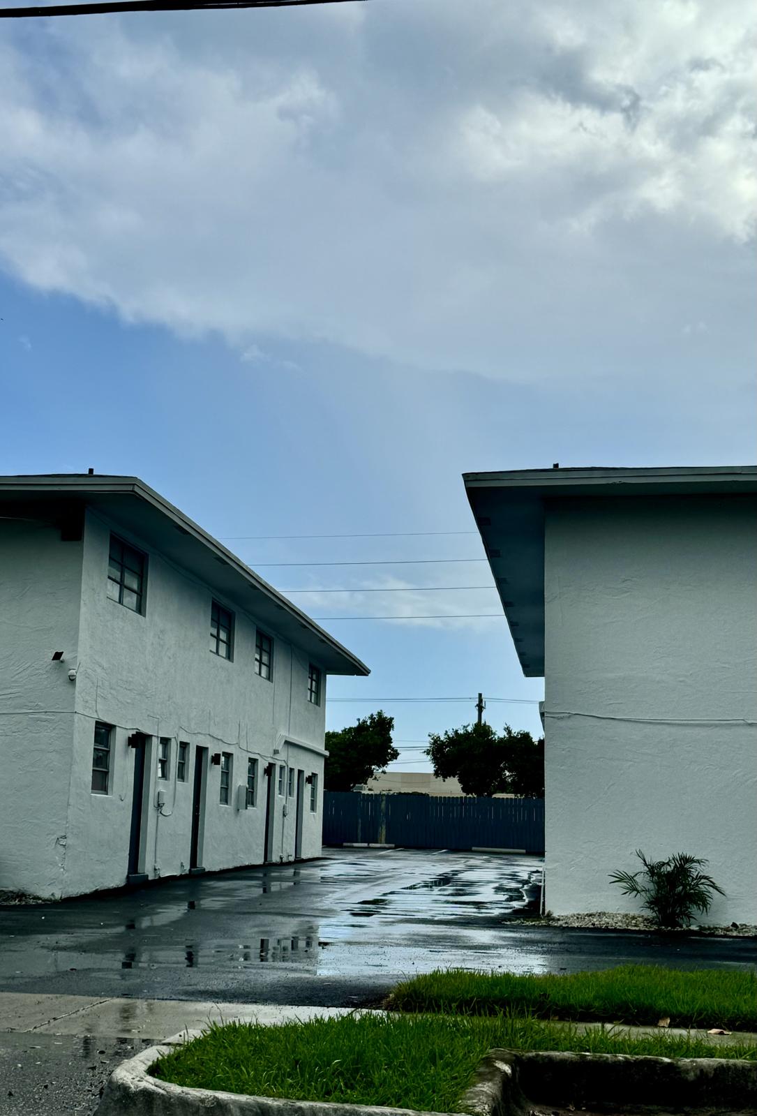 a small house in front of a building