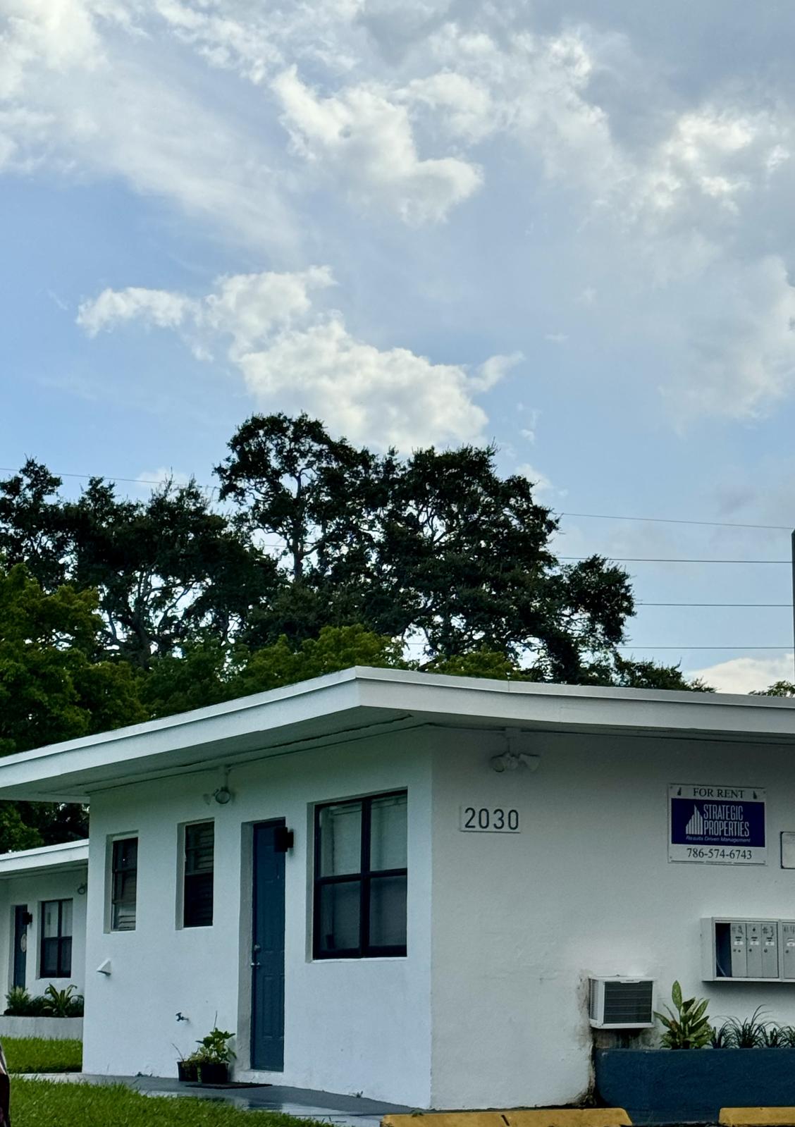 a house with trees in the background