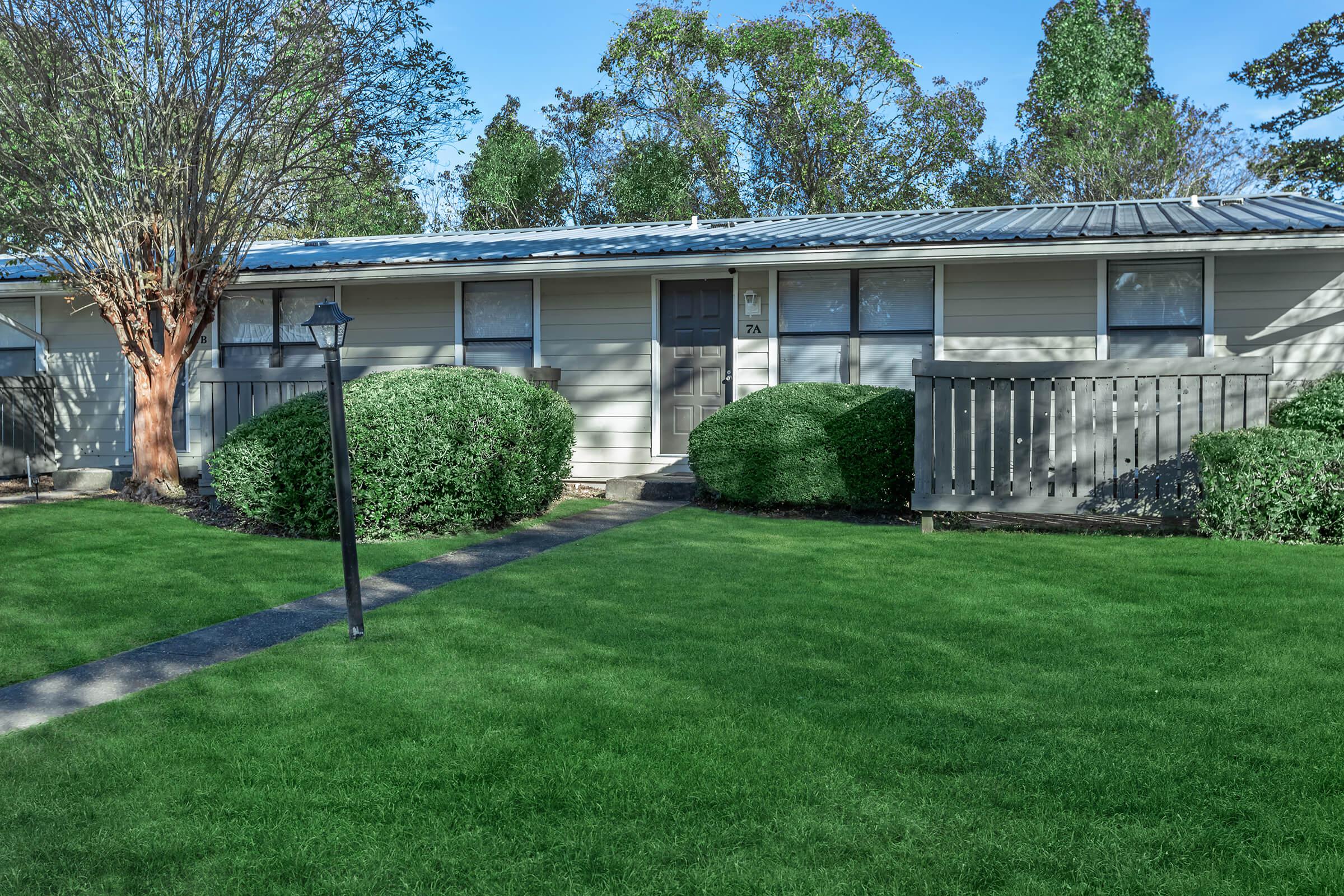 a large lawn in front of a house