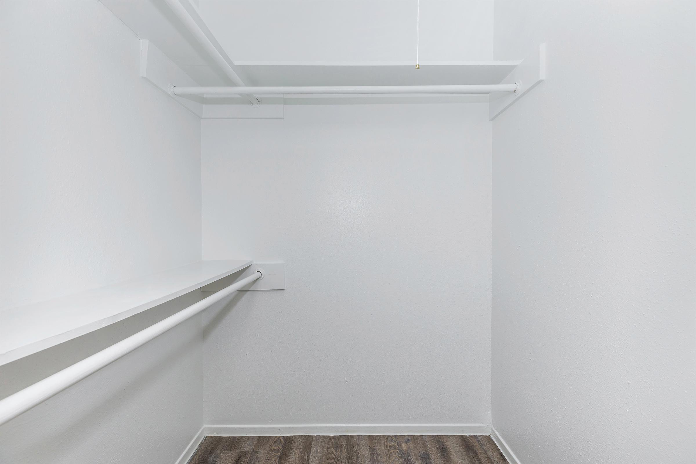 a white refrigerator freezer sitting inside of a building