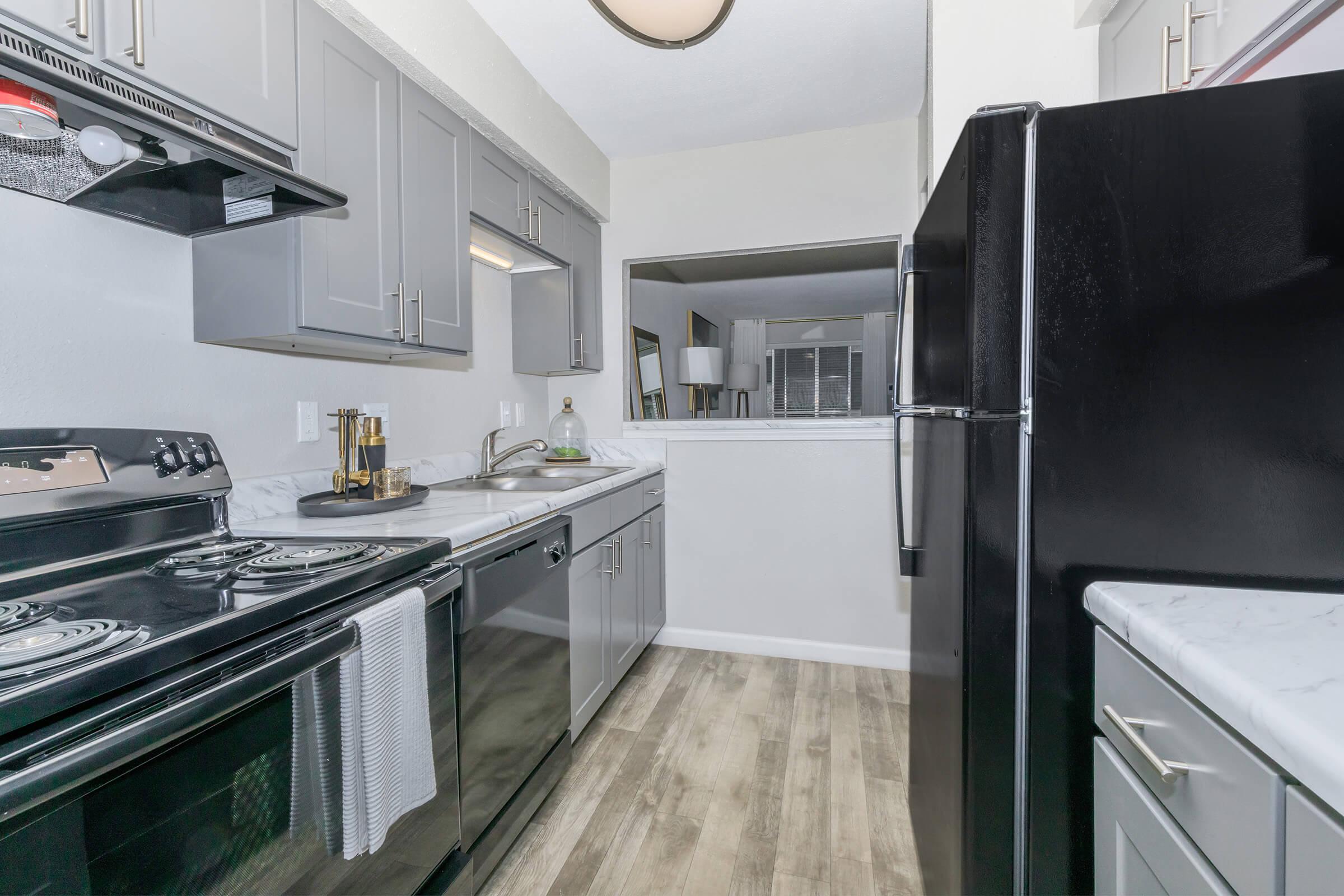 a large kitchen with stainless steel appliances