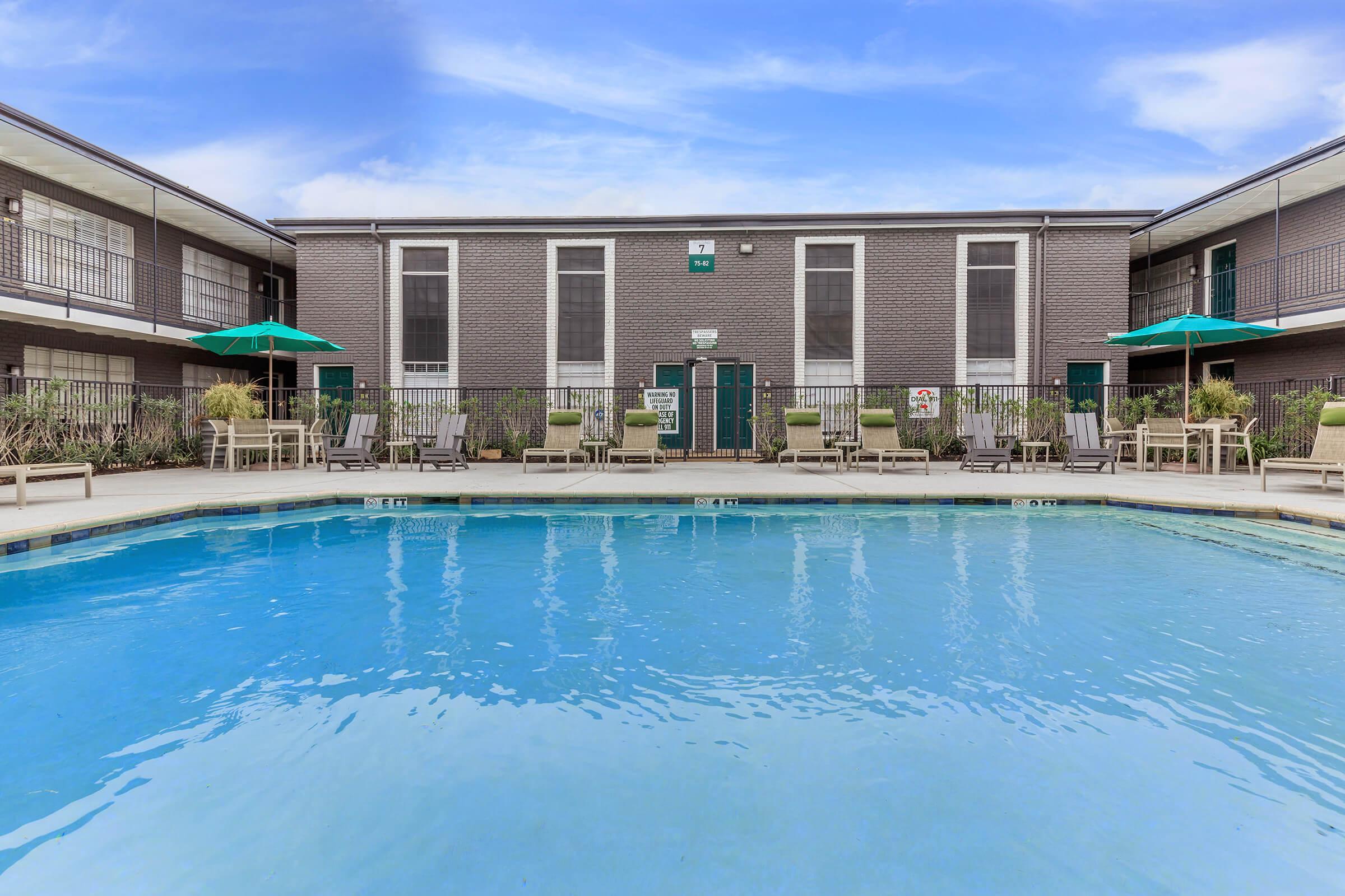 a large pool of water in front of a building