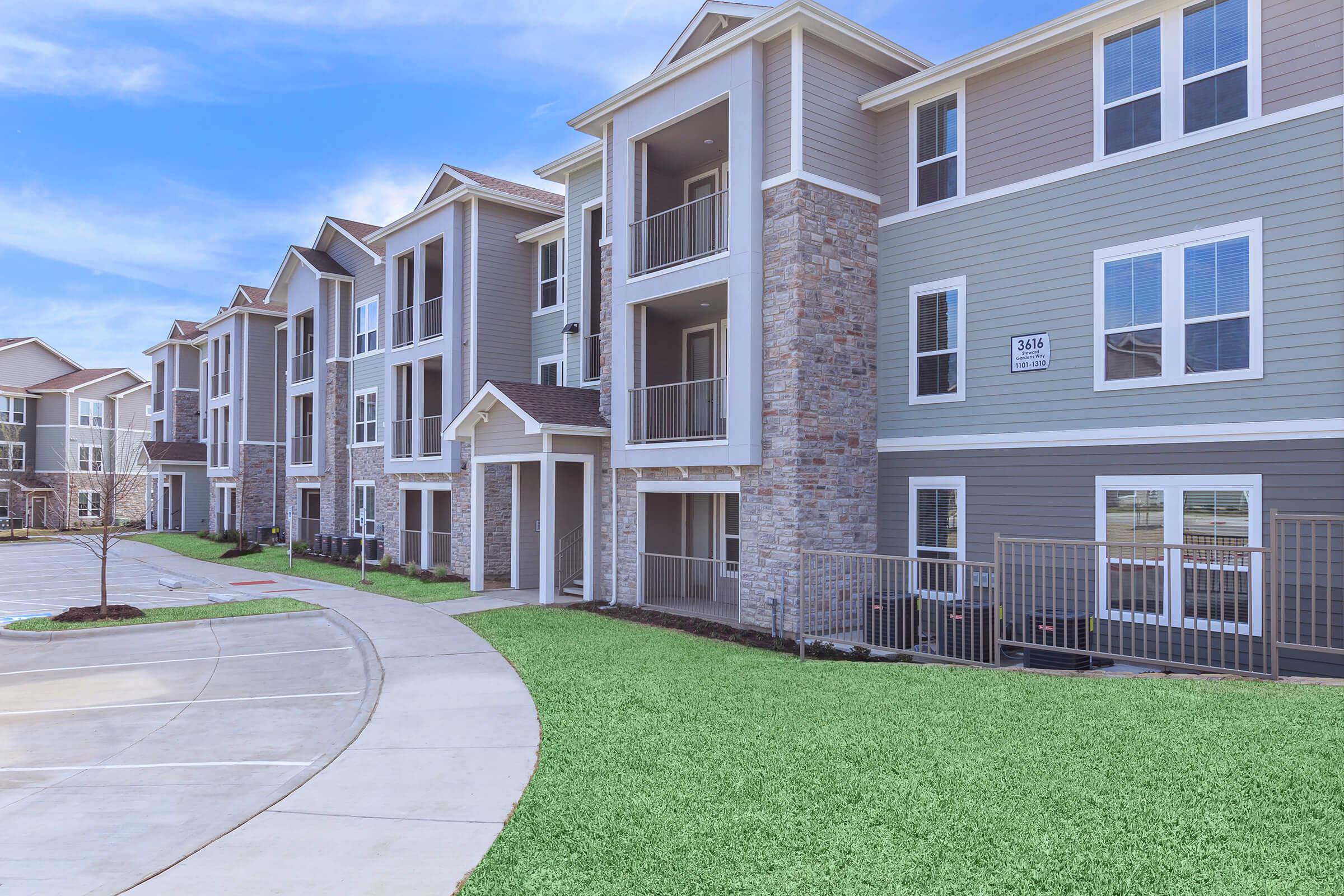 a large lawn in front of a building