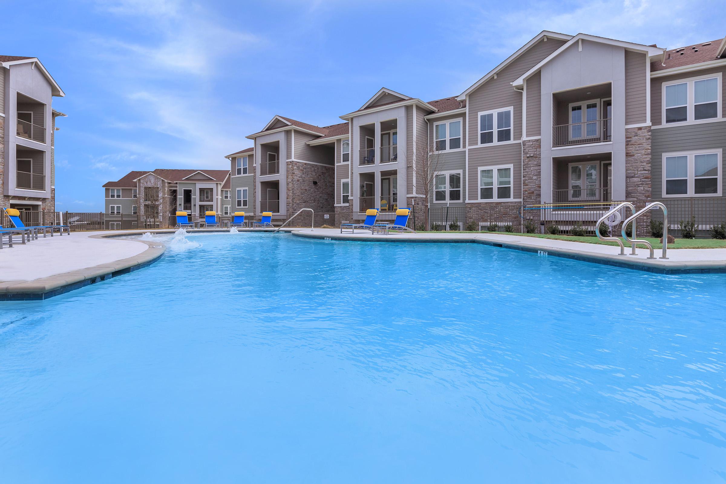 a large pool of water in front of a building