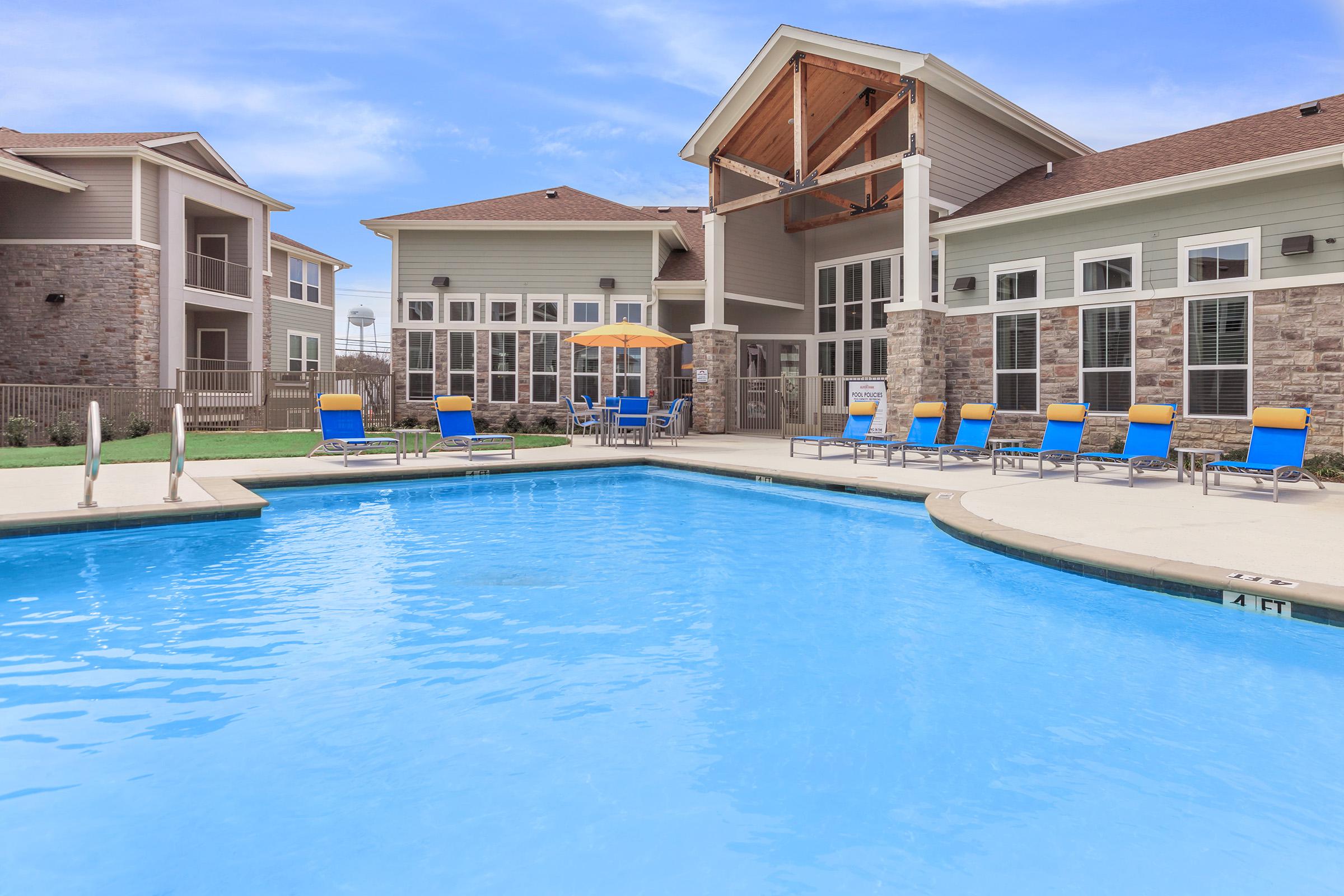 a house with a large pool of water