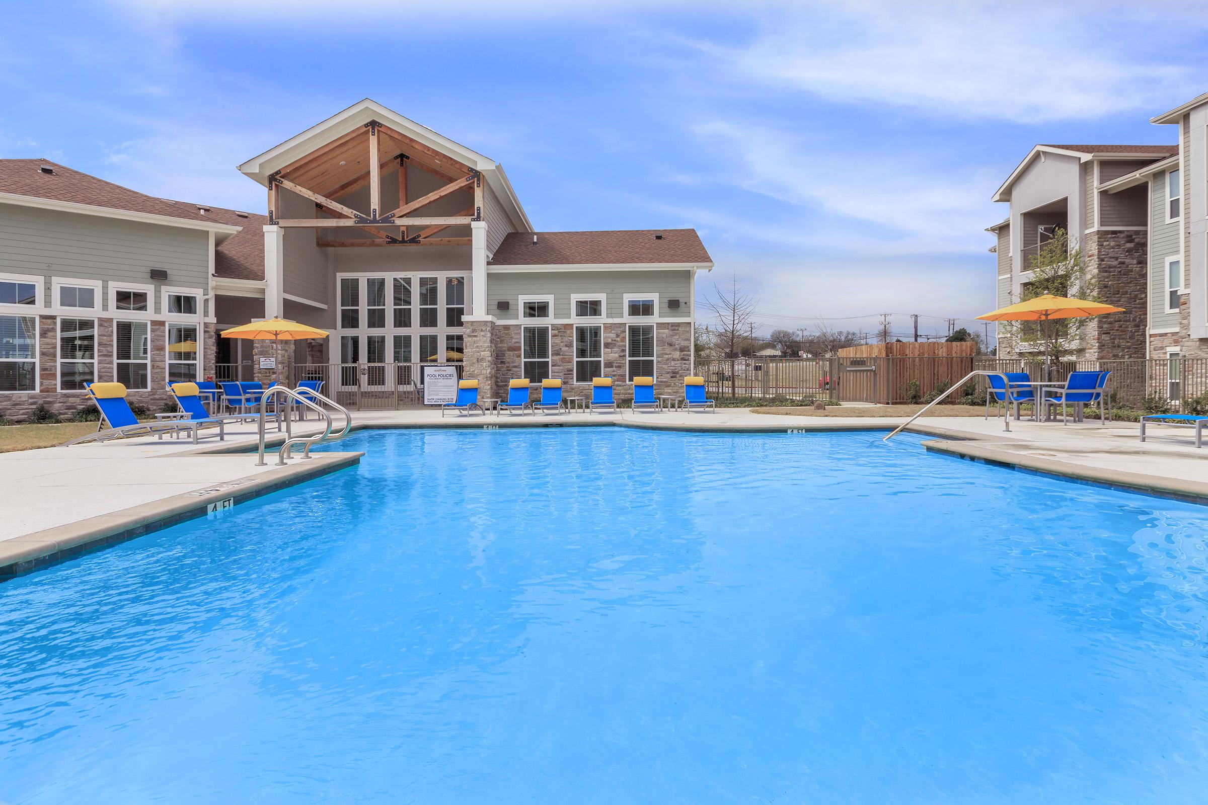 a house with a large pool of water