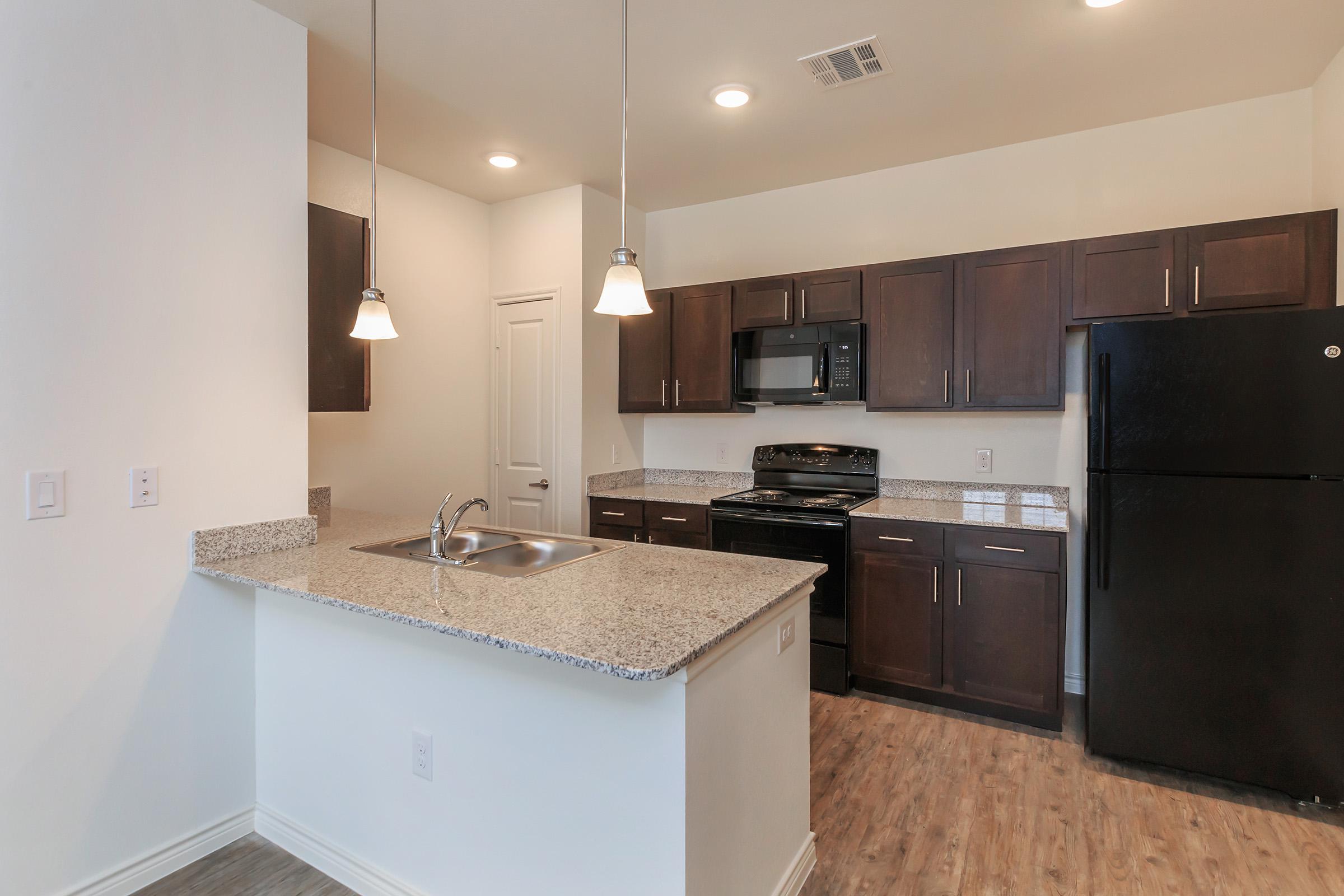 a modern kitchen with stainless steel appliances