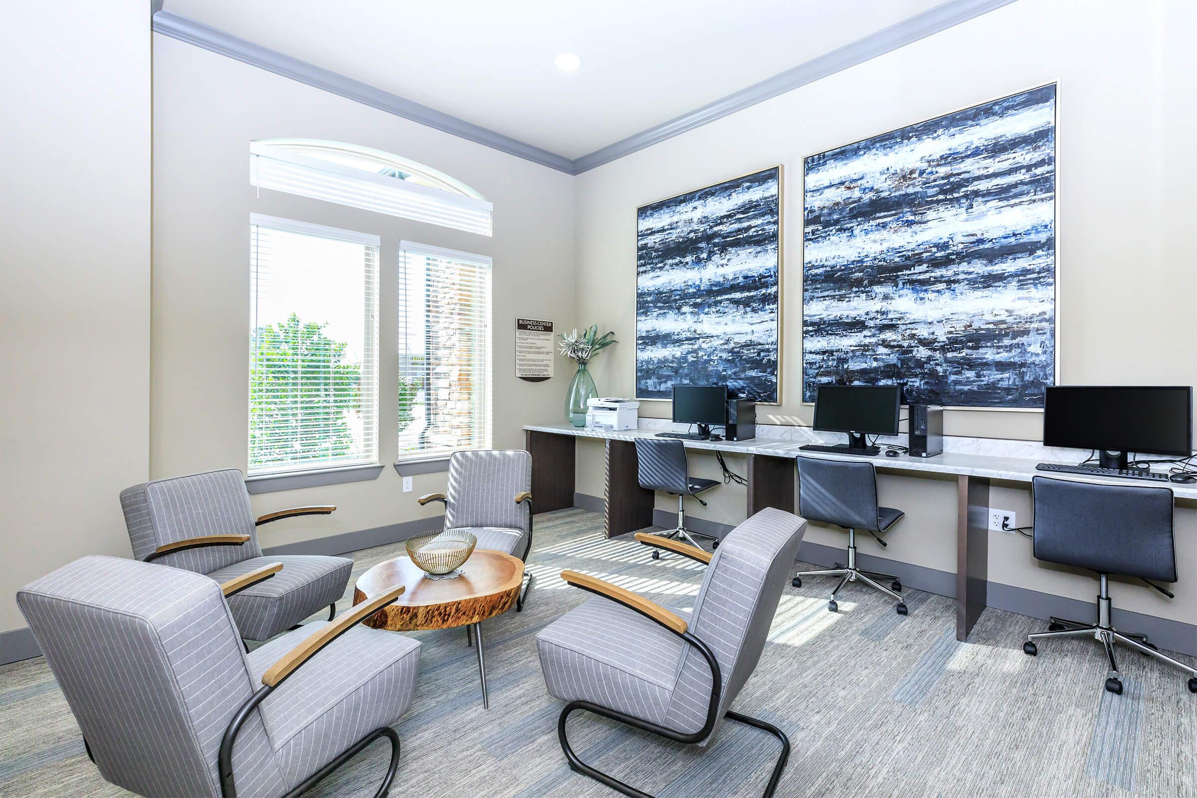 a living room filled with furniture and a large window