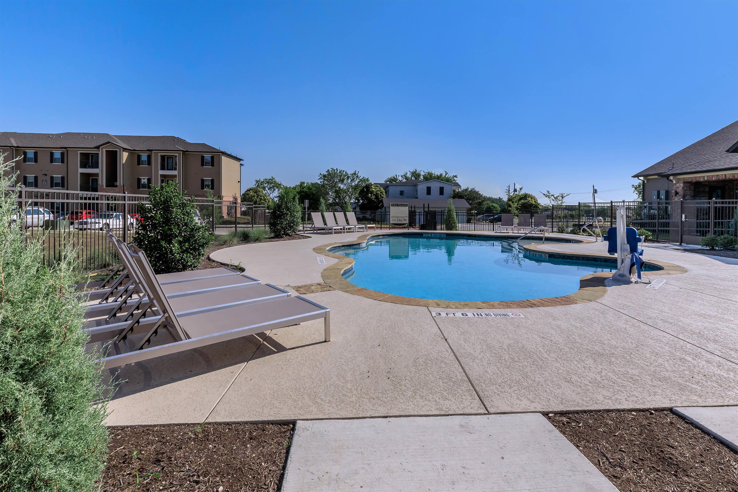 a house with a pool outside of a building