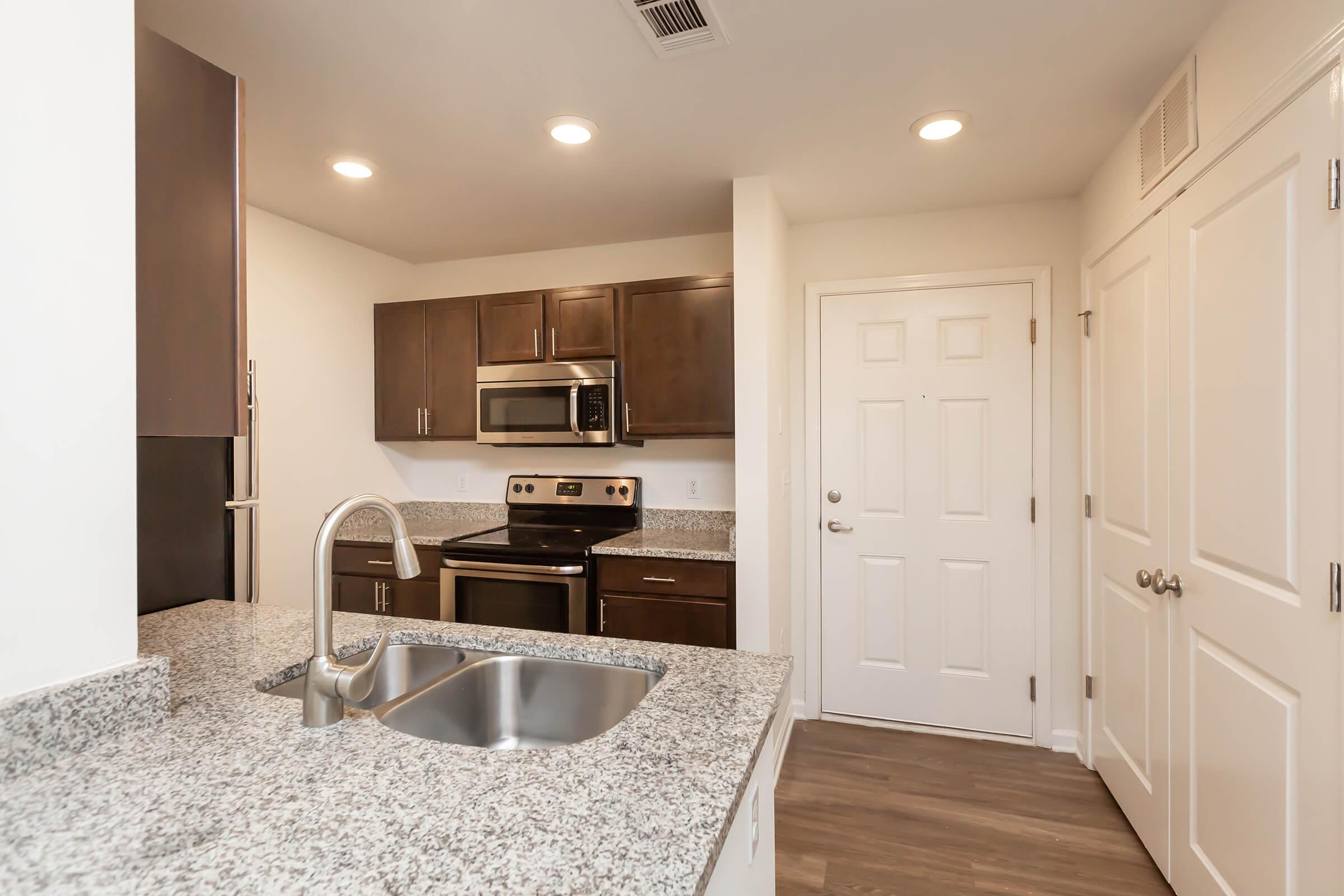 a modern kitchen with stainless steel appliances
