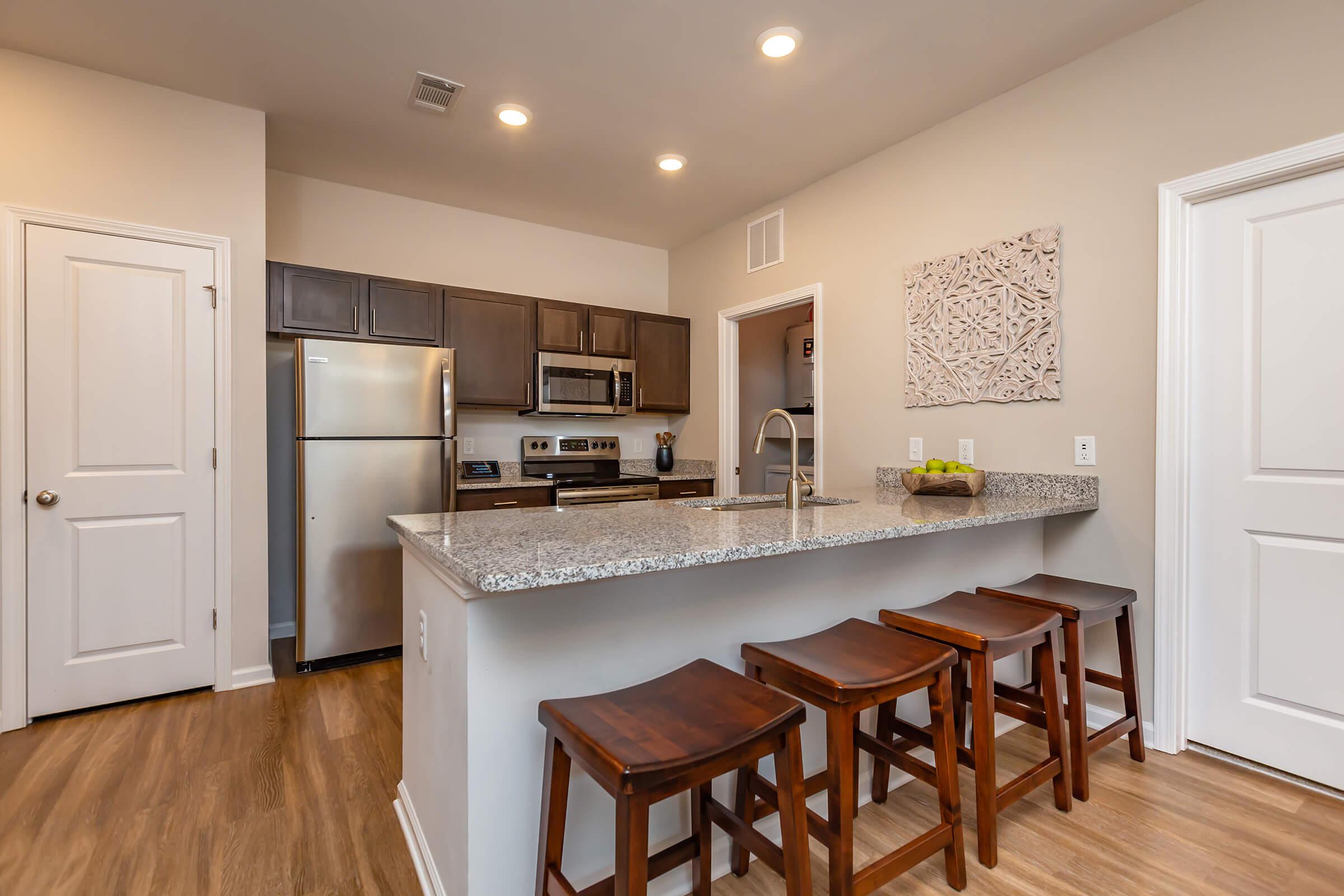 a kitchen with a wood floor