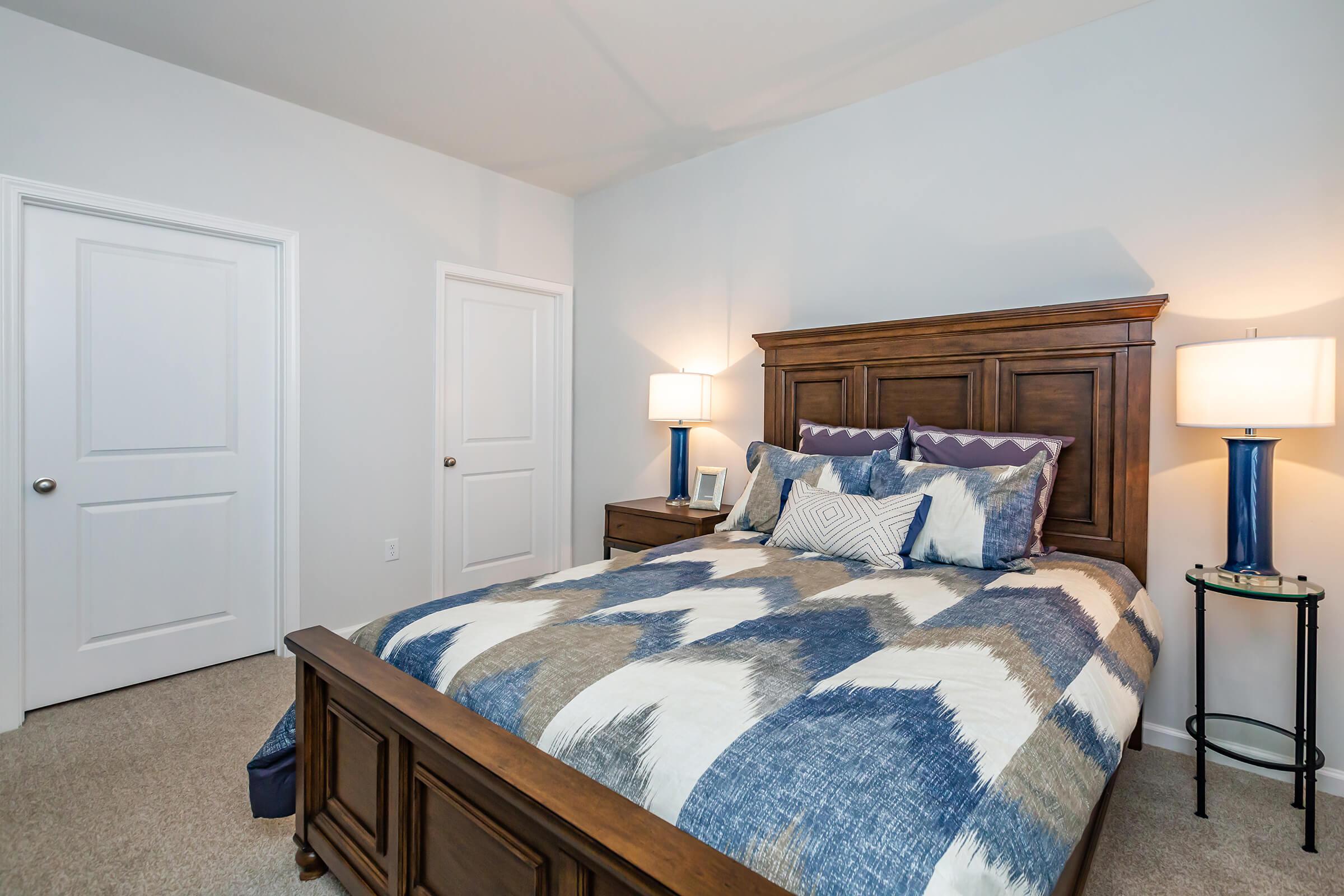 a bedroom with a bed in a hotel room
