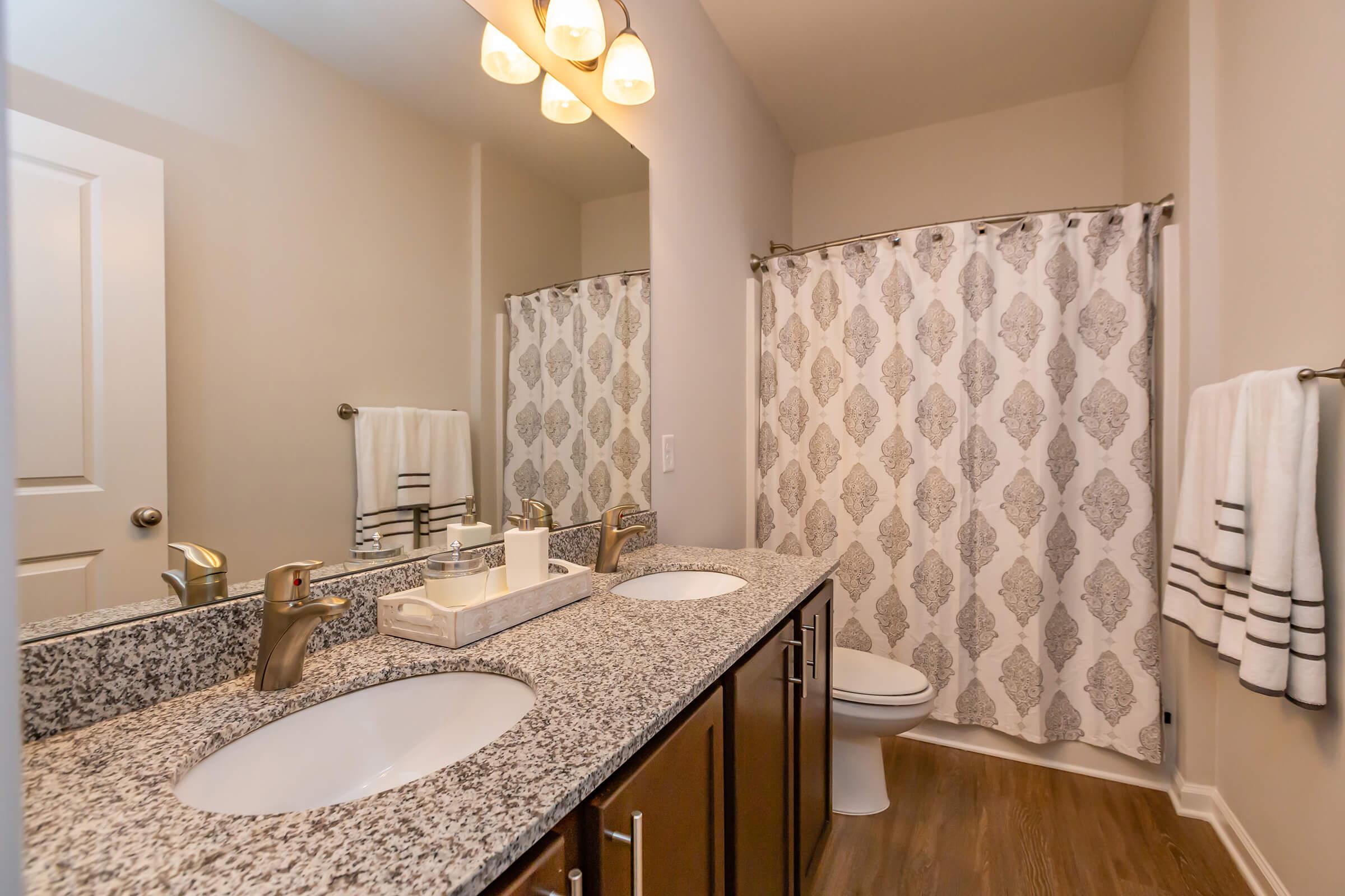 a room with a sink and a mirror