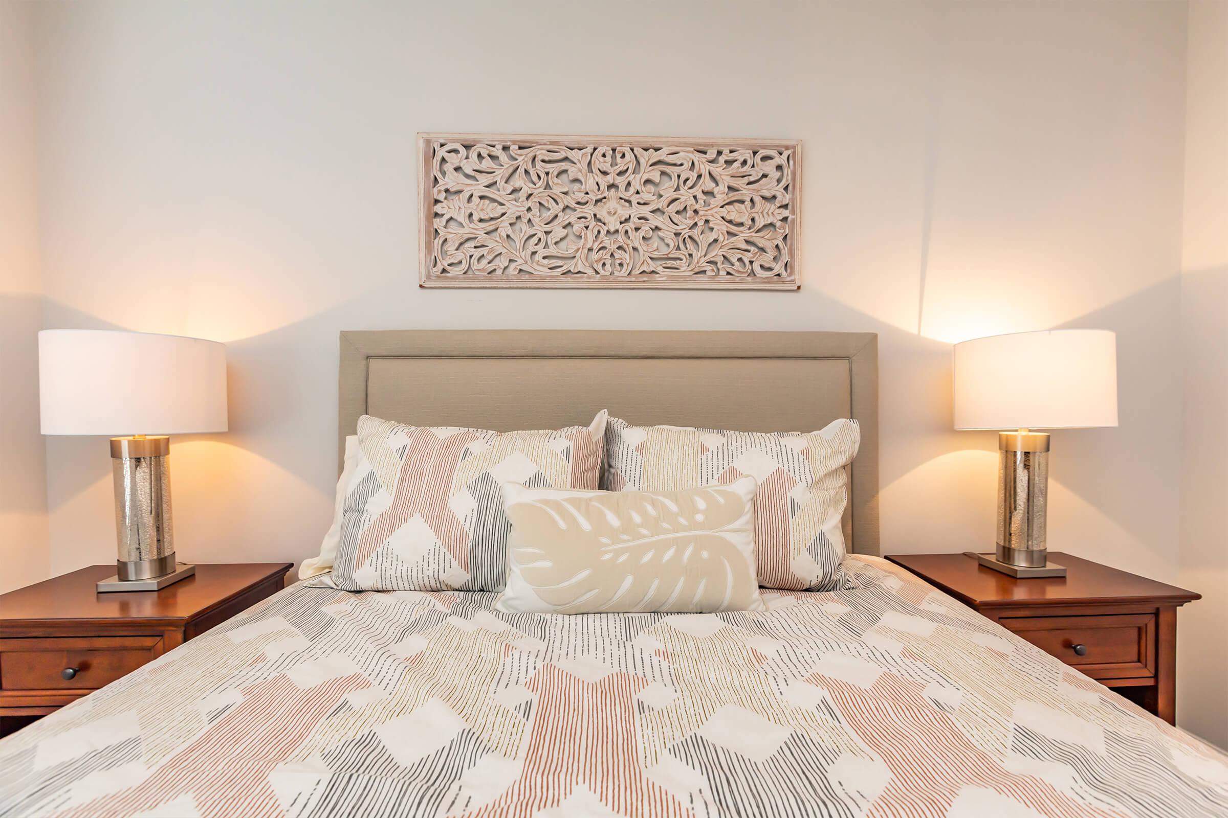 a bedroom with a bed in a room