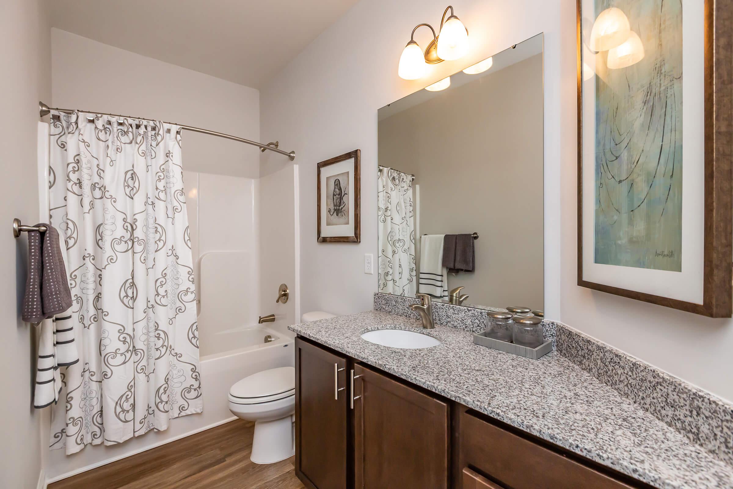 a room with a sink and a mirror