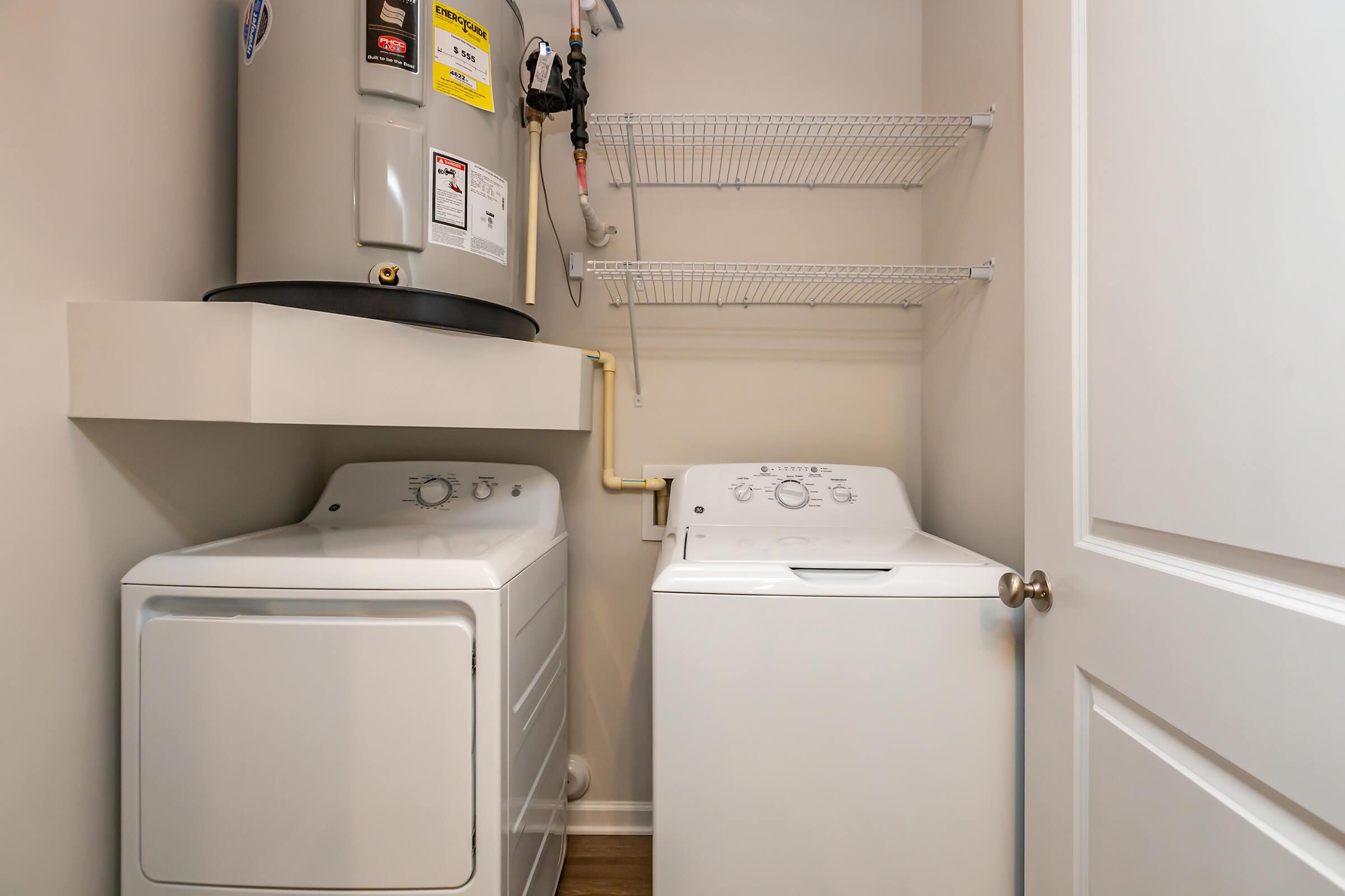 a white refrigerator freezer sitting next to a sink