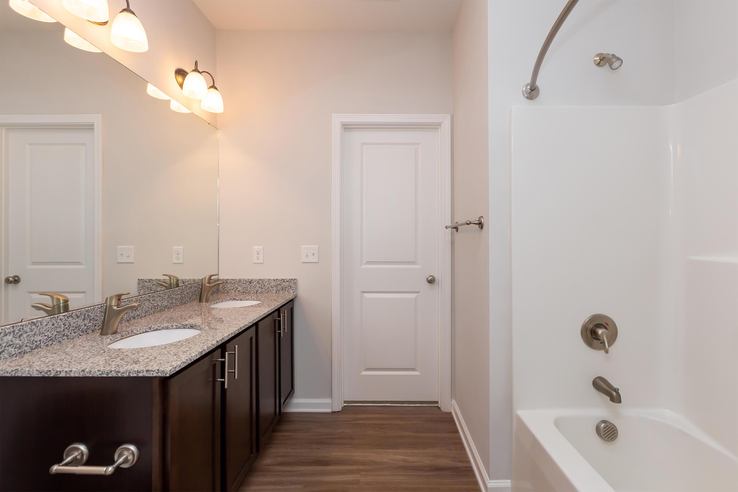 a room with a sink and a mirror
