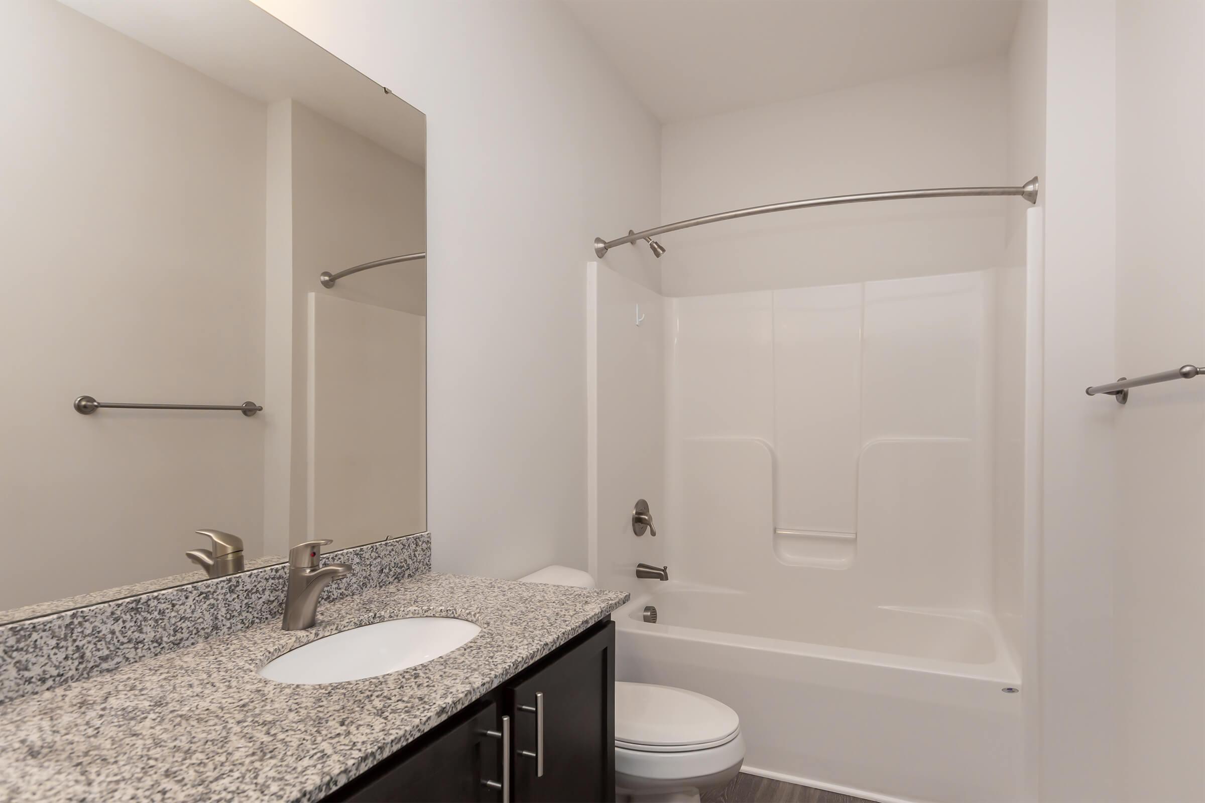 a room with a sink and a mirror