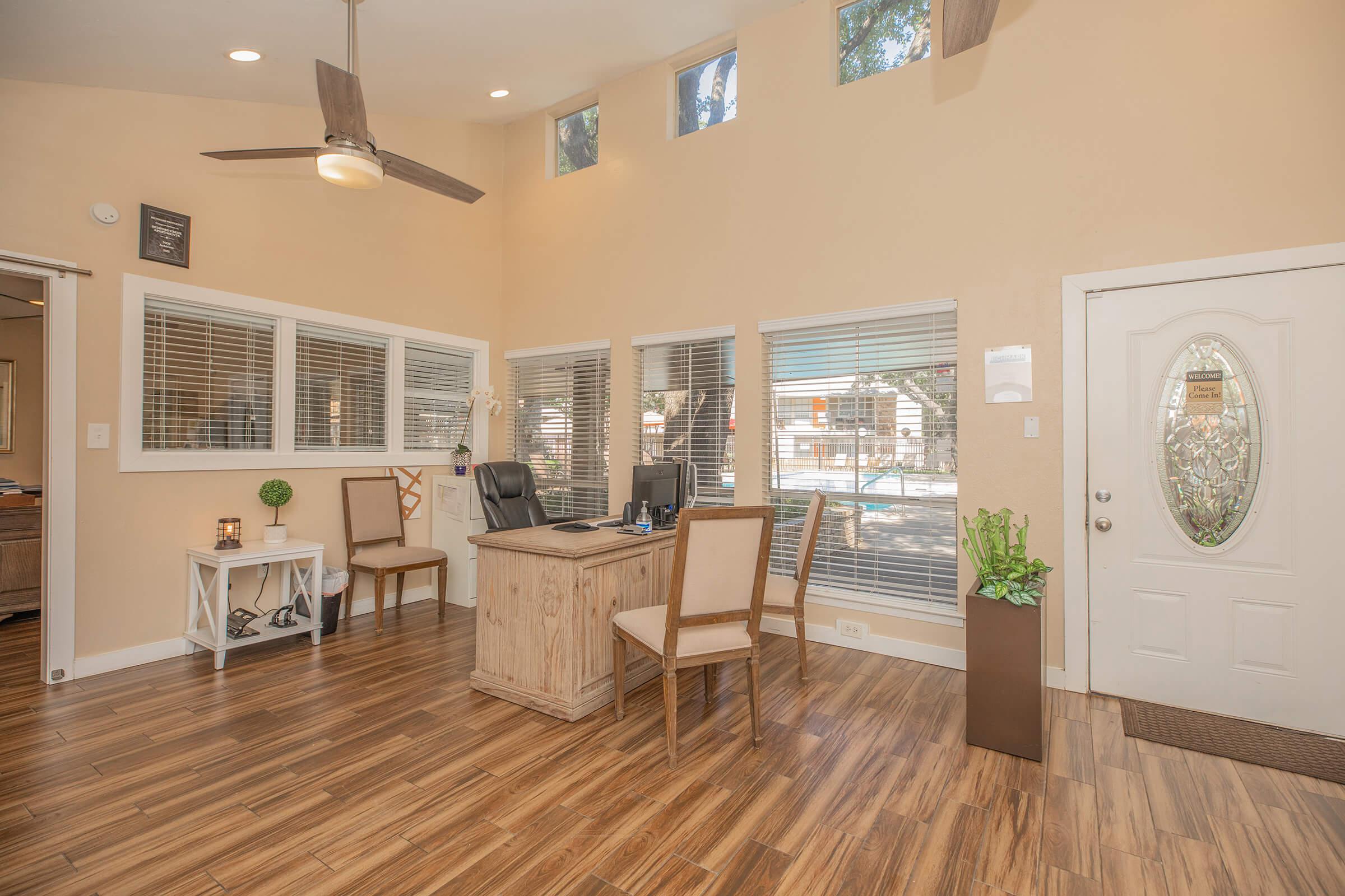 a living room filled with furniture and a large window