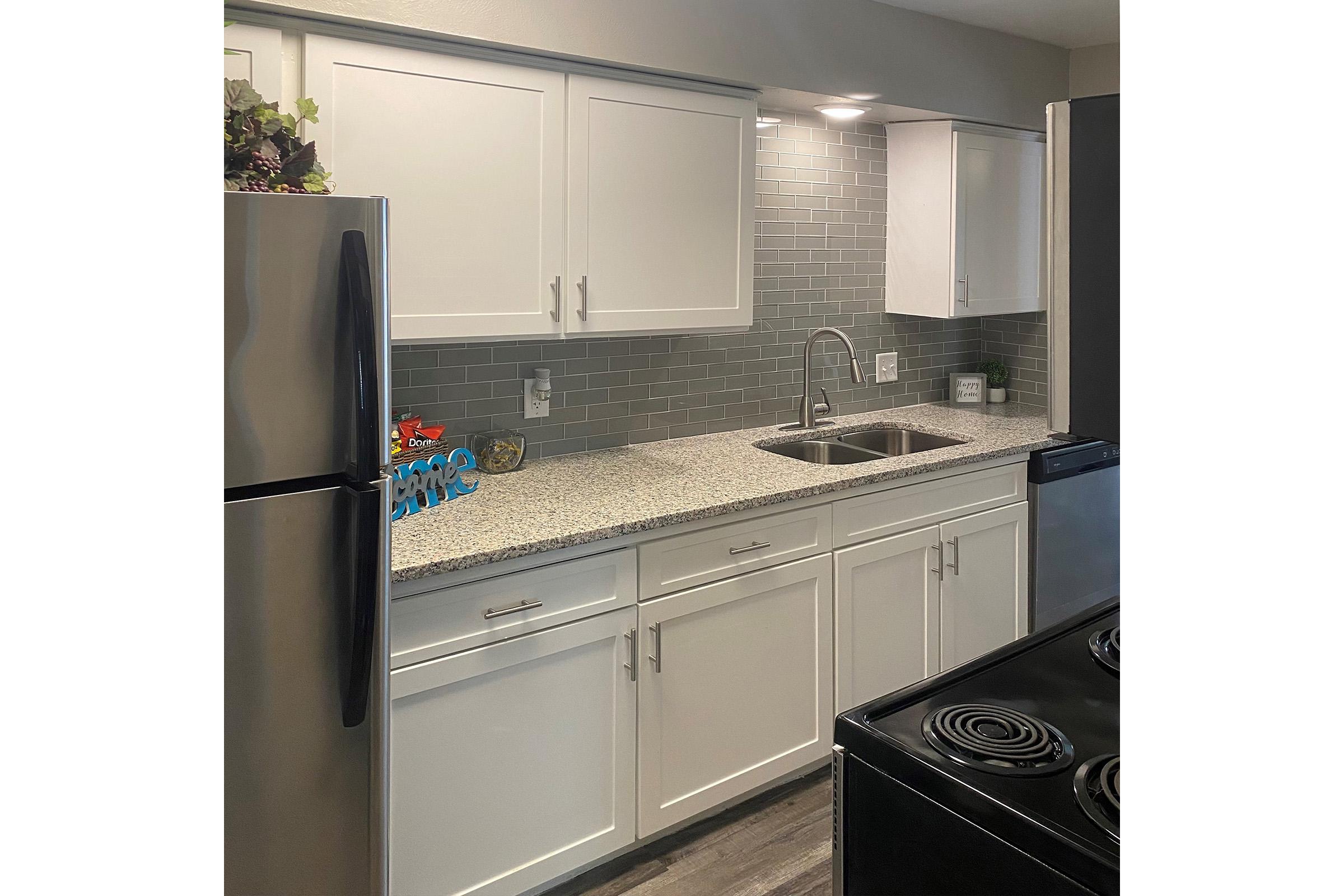 a stainless steel refrigerator in a kitchen