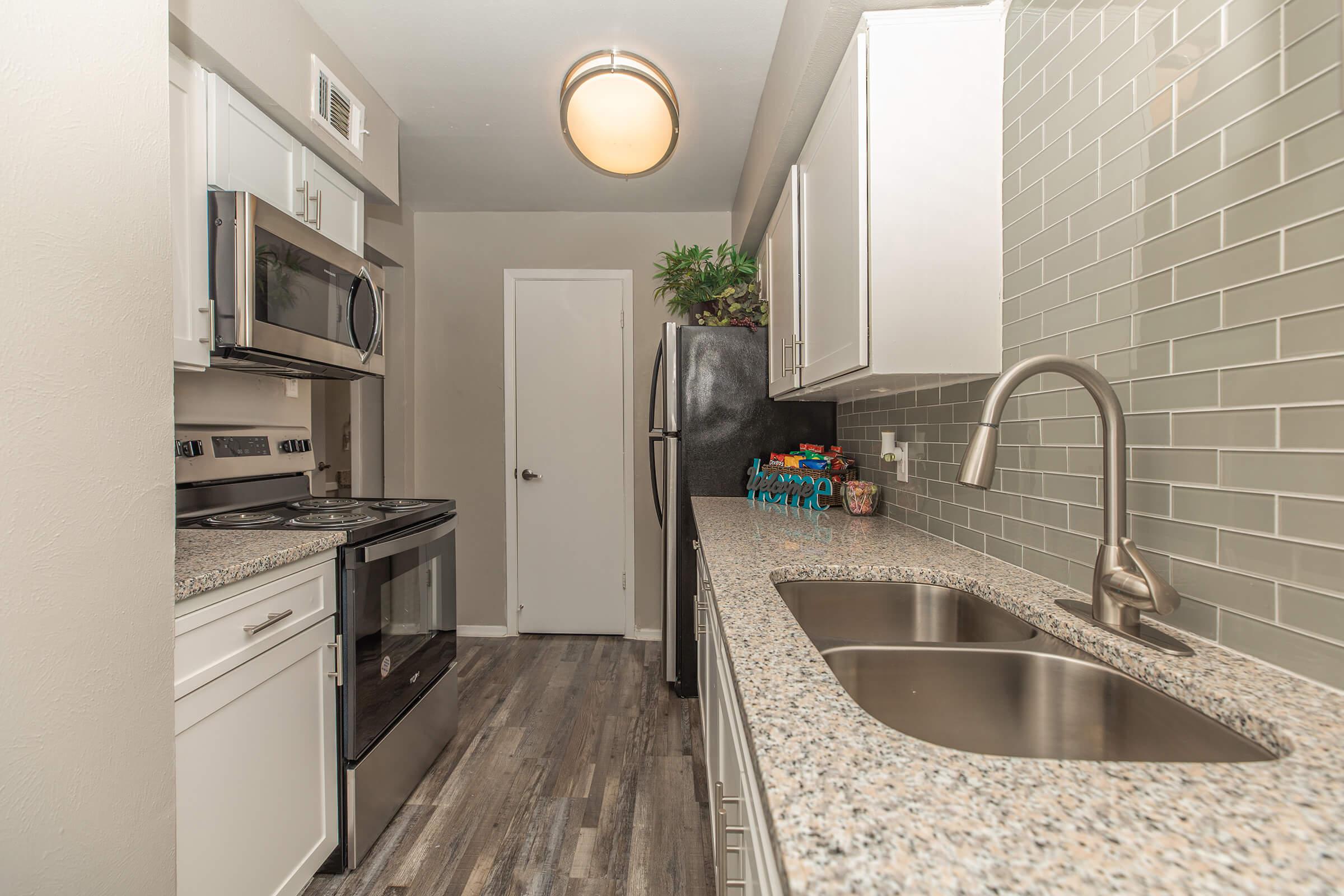 a kitchen with a sink and a window